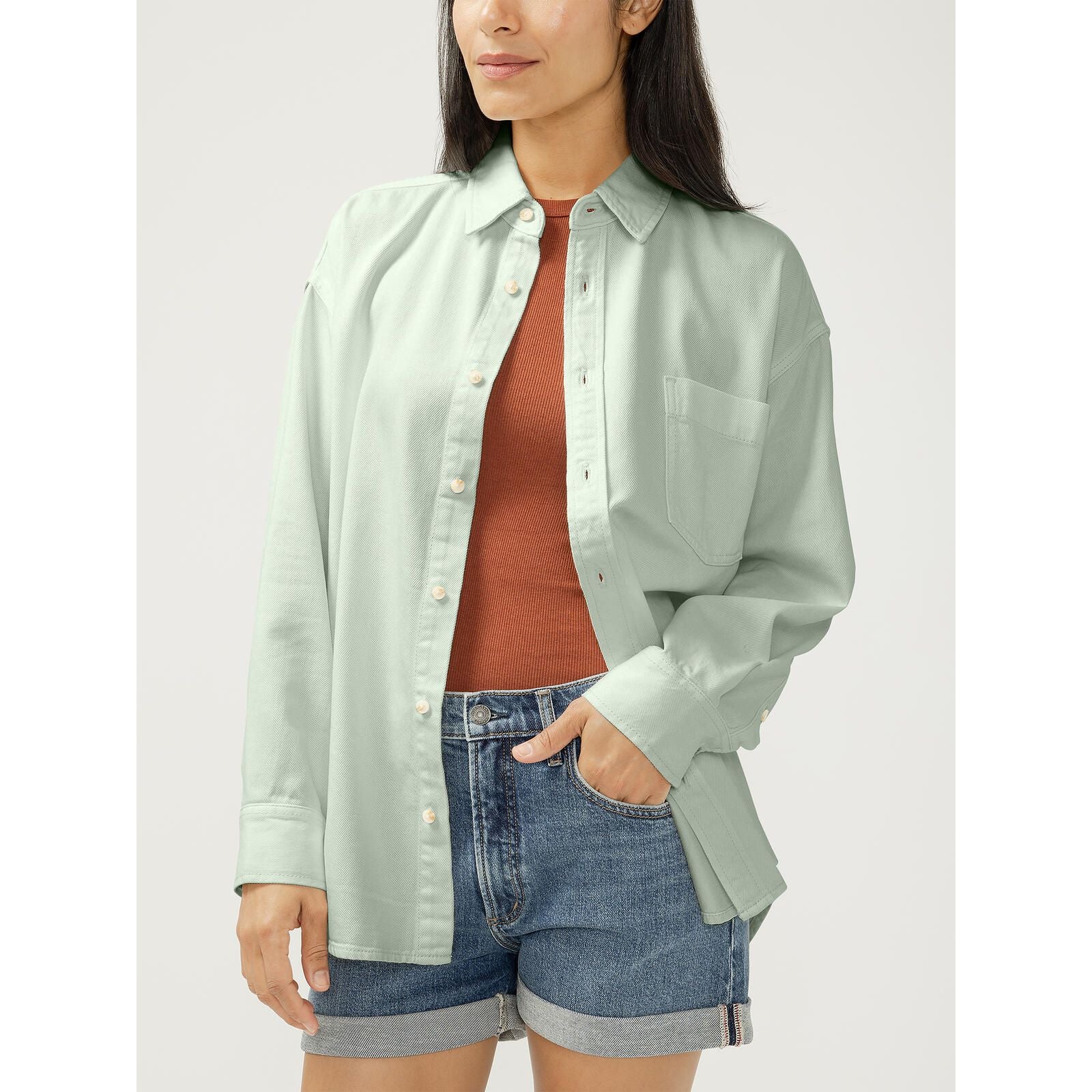 Silver Relaxed Fit Beach Shirt with button-front and chest pocket on model, paired with rust top and denim shorts.