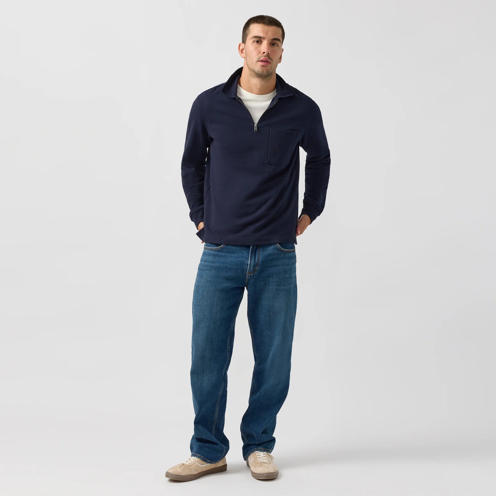 Man modeling Silver Relaxed Straight jeans in Rocky wash, a deep Y2K indigo with soft stretch and extra room through the hip and thigh.