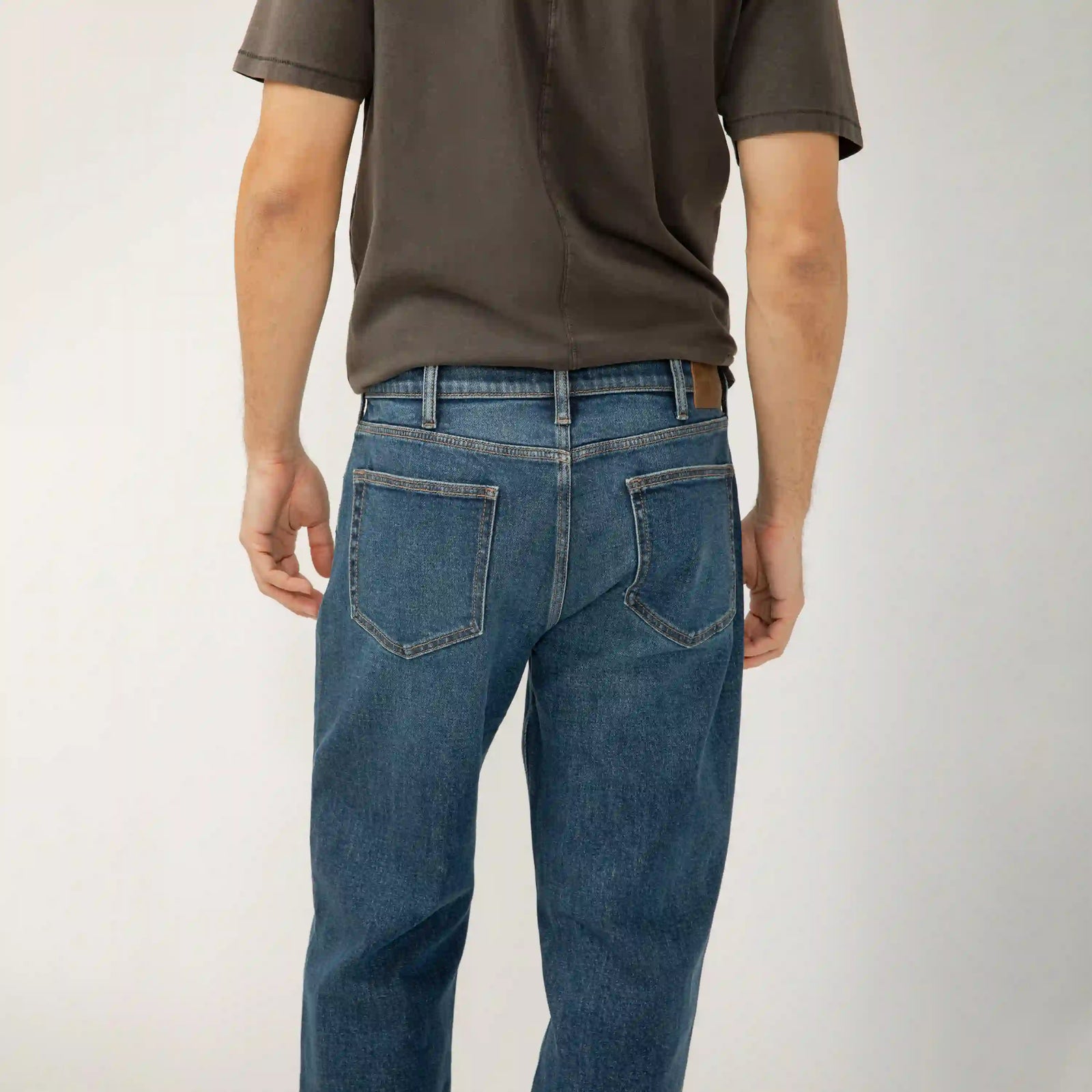Back view of silver relaxed straight denim jeans in Rocky wash, featuring Y2K-inspired indigo and extra room through the hip and thigh.