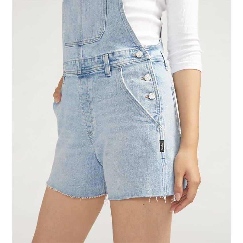 Stylish Silver Shortalls Indigo featuring light distressing, adjustable straps, and a vintage-inspired design. Perfect for spring!