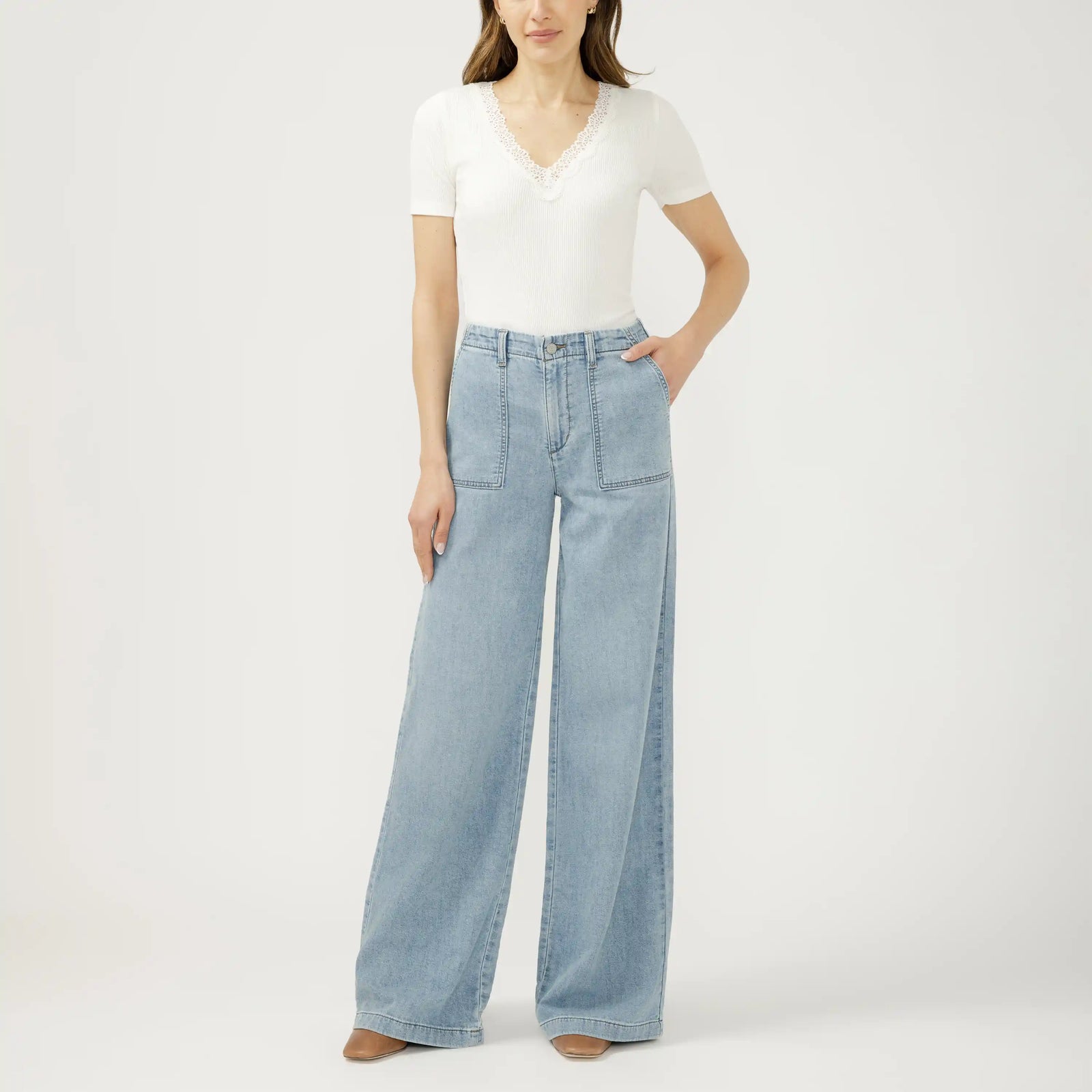 Light wash wide leg knit flex denim jeans in Crickets. Relaxed silhouette with a soft, stretchy fit that moves easily.