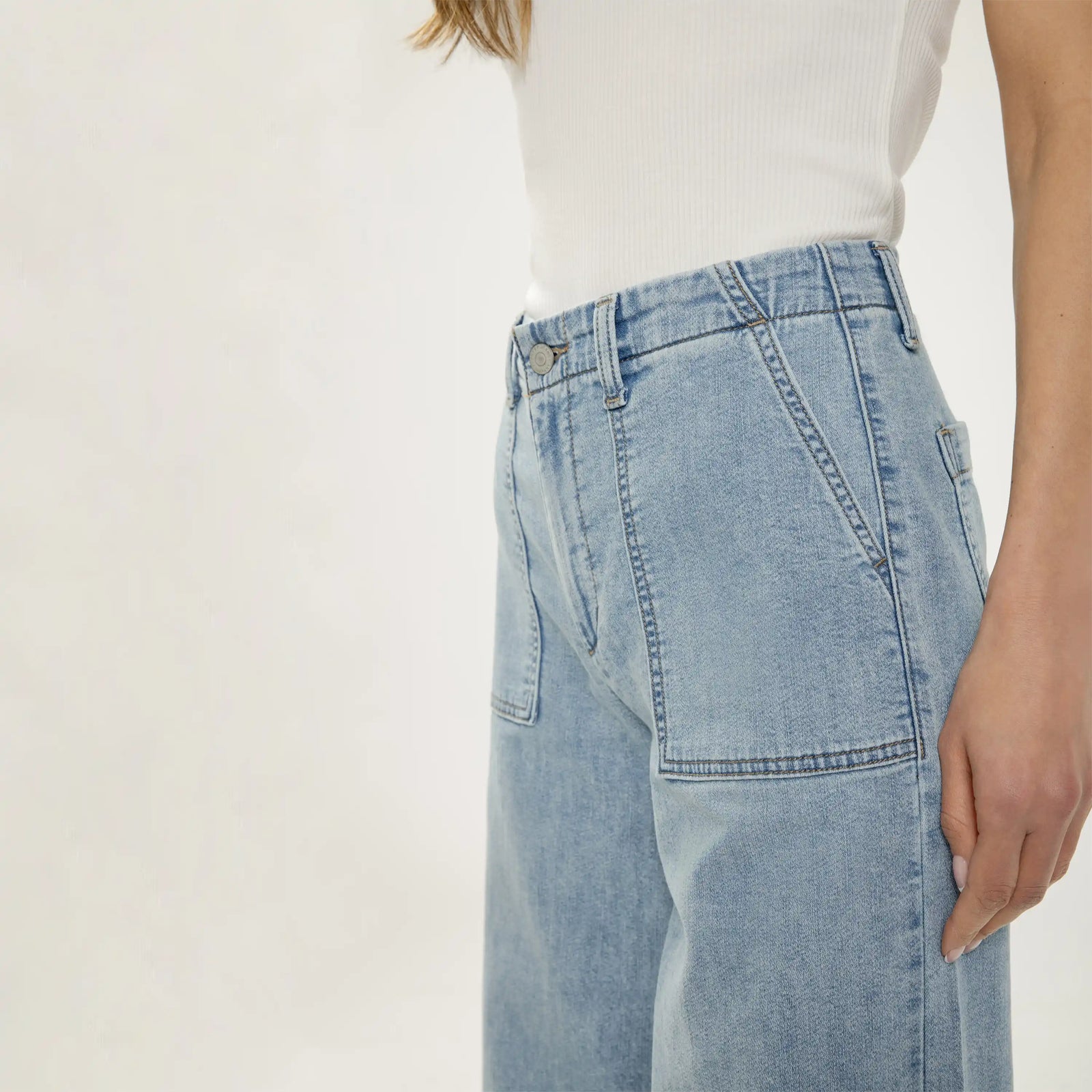 Silver wide leg knit flex denim jeans in light crisp wash. Relaxed fit with soft, denim-look fabric and clean hanging silhouette.