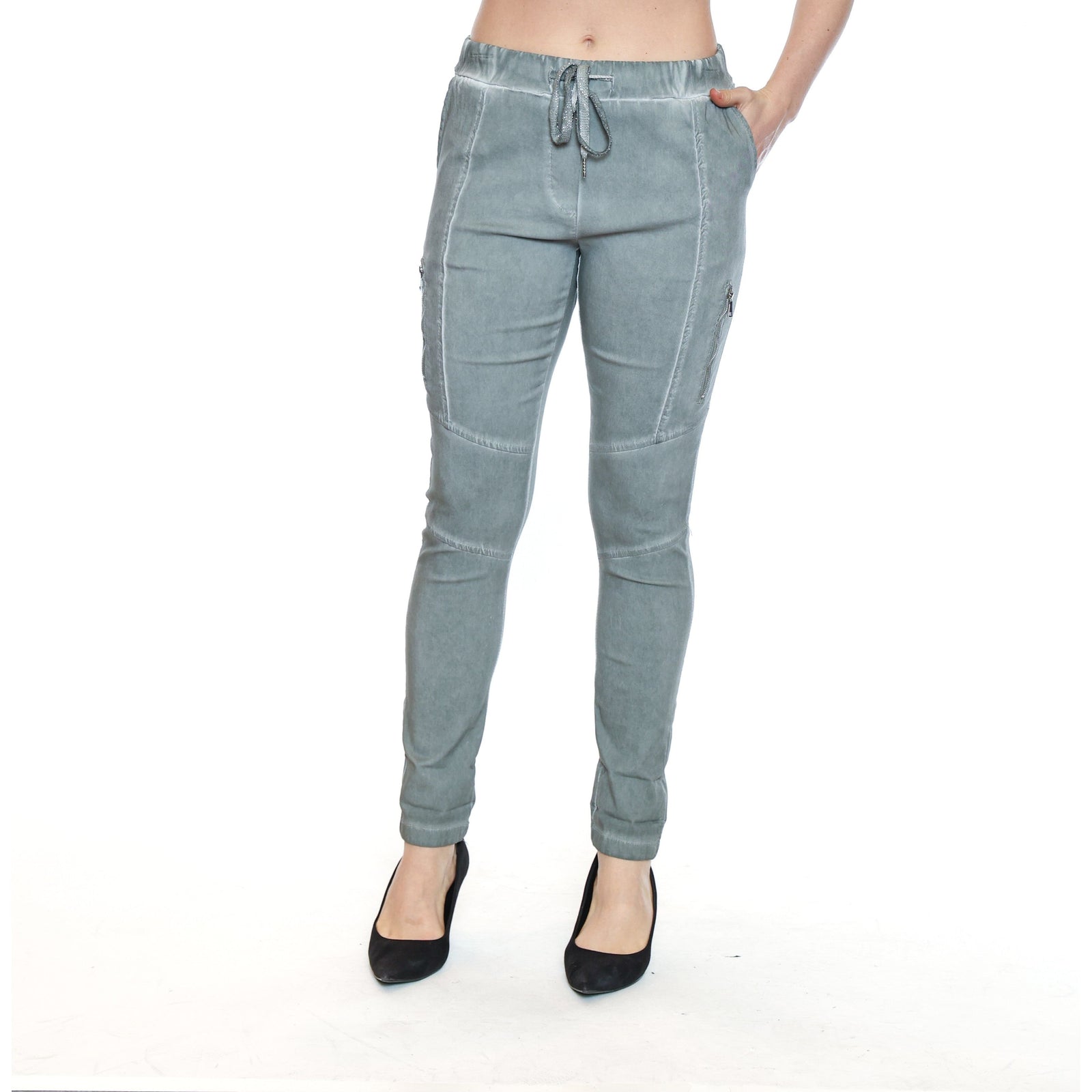 Elevate your style with the Sorella Pant with Zipper Detail Sage, featuring luxurious fabric and edgy zipper accents.