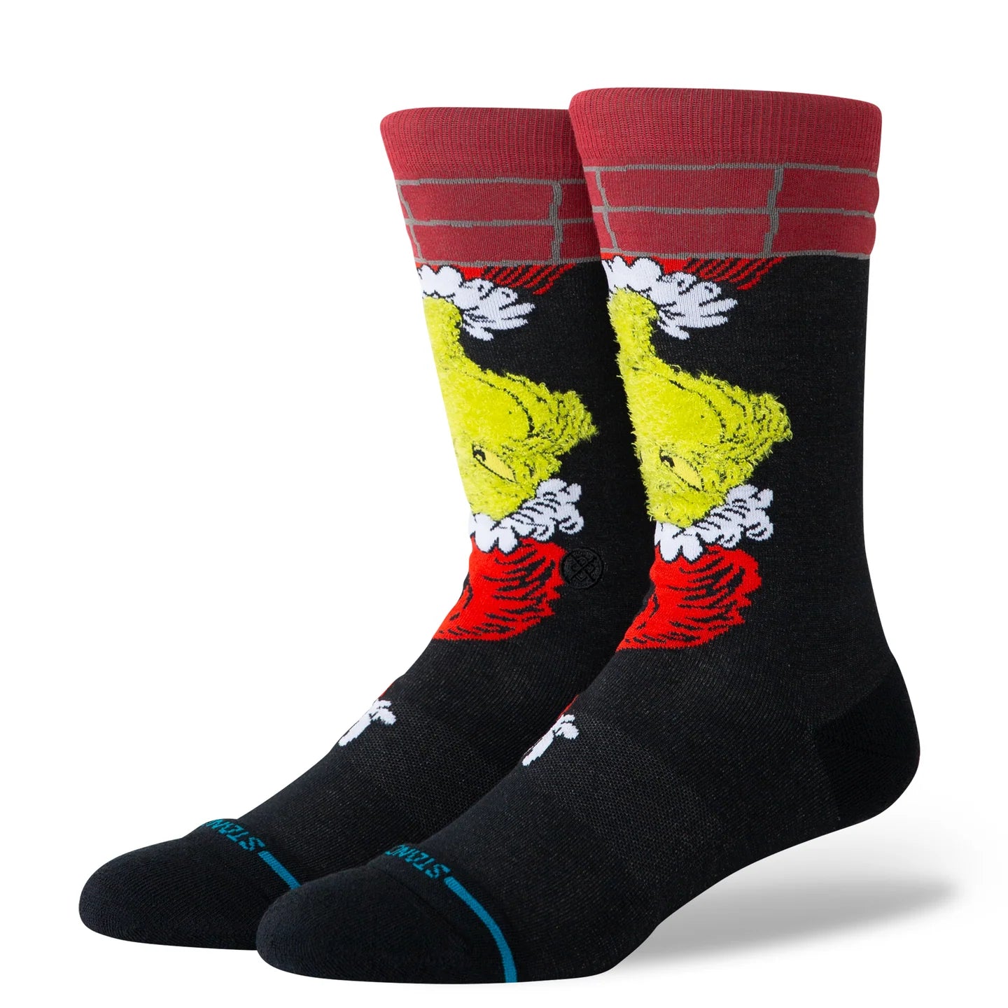 Stance Grinch Down the Chimney black crew socks featuring the Grinch sliding down a red brick chimney with snow accents and a plush red cuff.