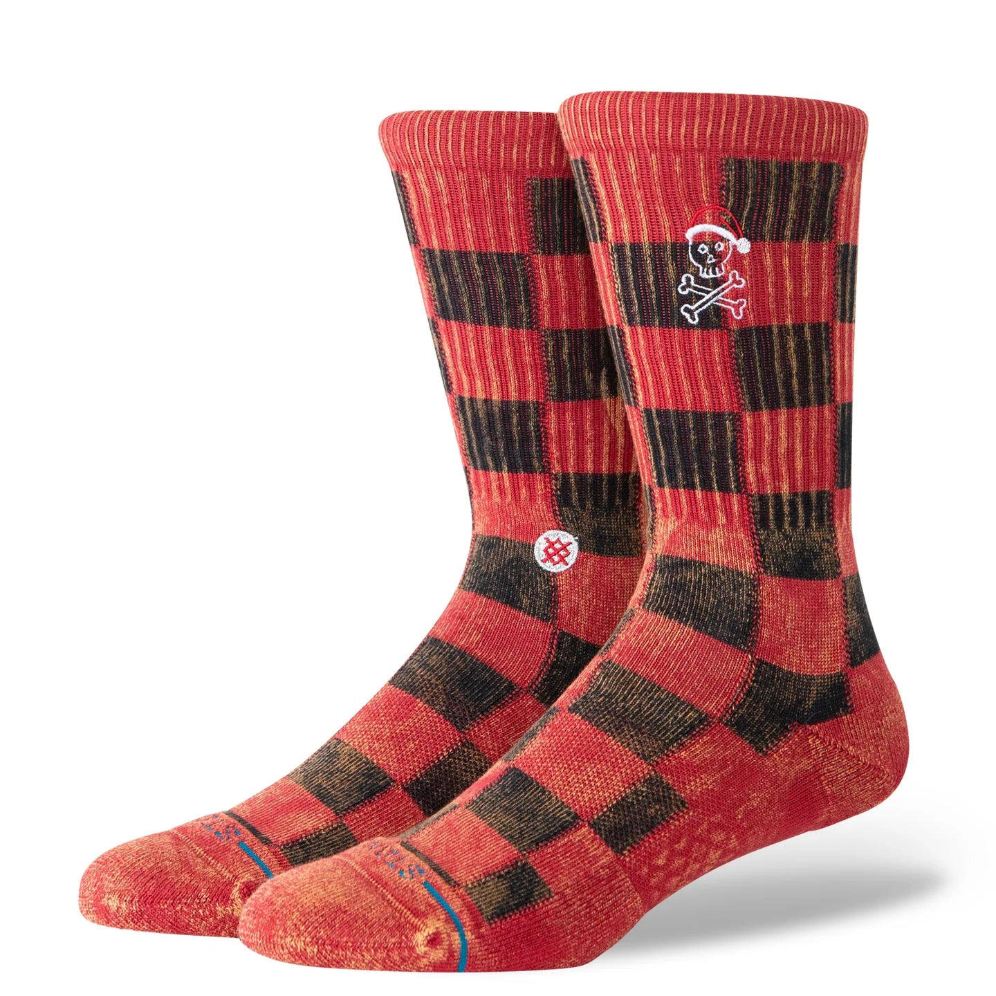 Red and black buffalo plaid crew socks featuring a skull wearing a Santa hat, Stance logo, and seamless toe.