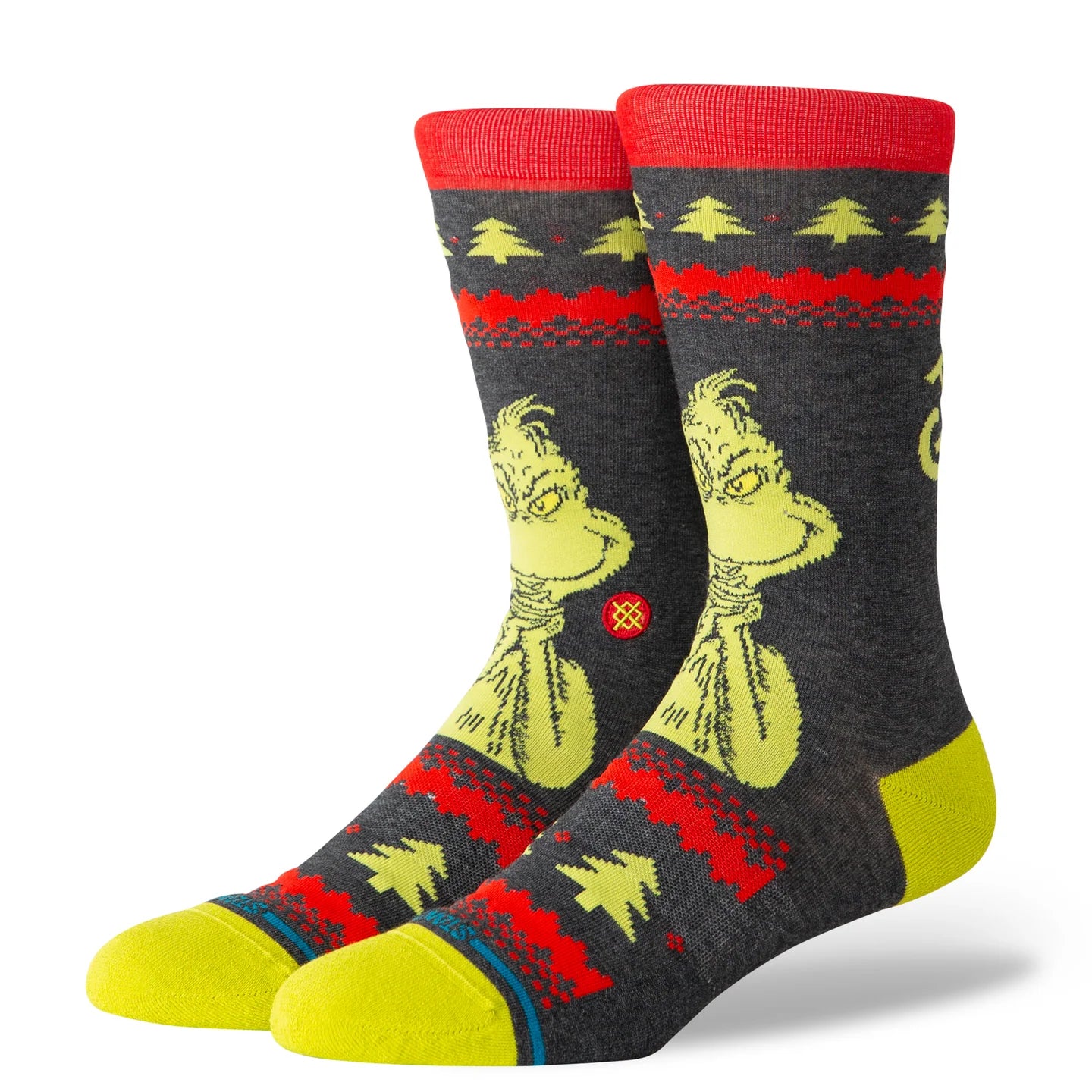 Black Stance Grinch crew socks with red cuff, yellow Grinch graphic, and festive sweater pattern.