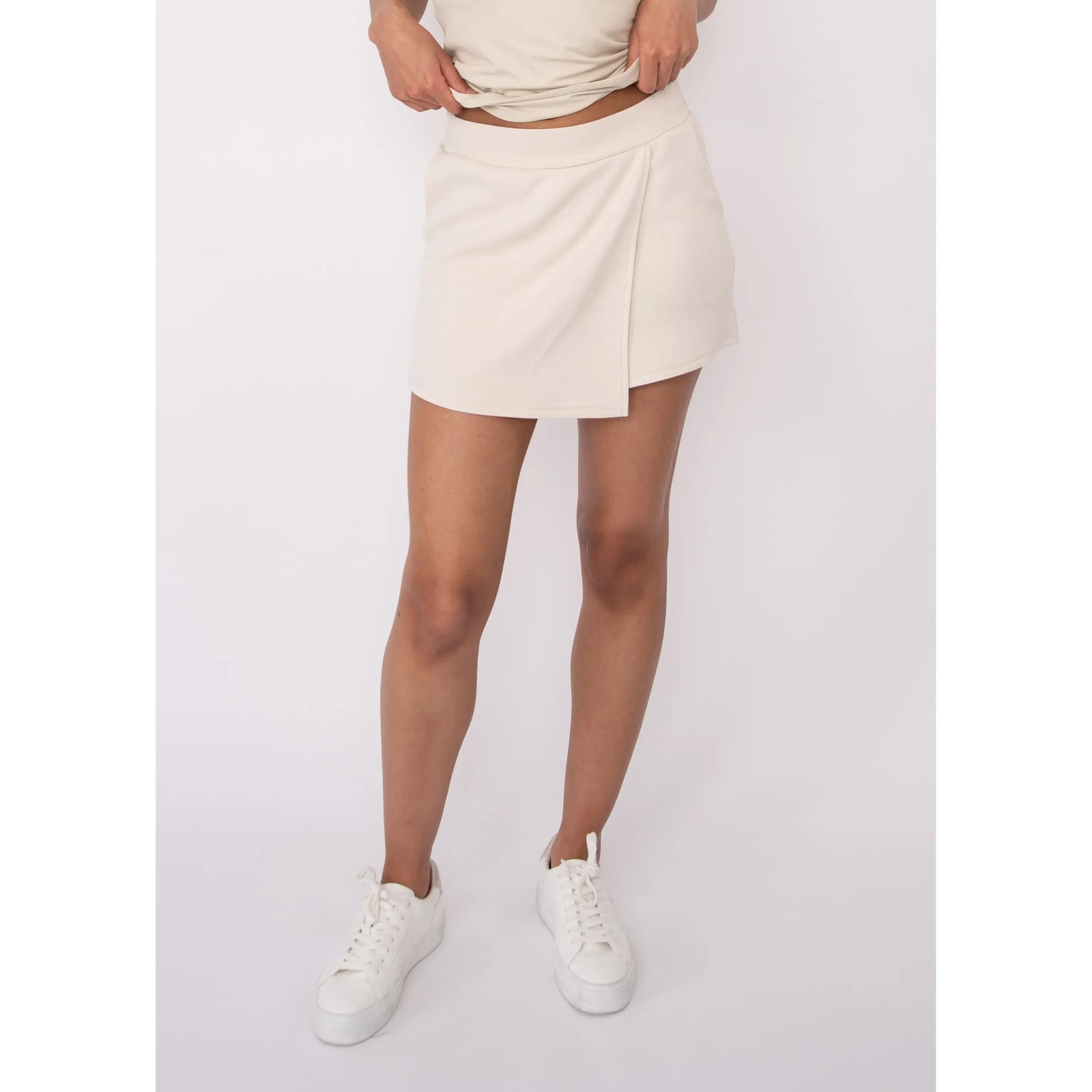 Starry Soft Knit Skort in cream, cozy knit fabric for sunny days, casual summer look with sneakers.