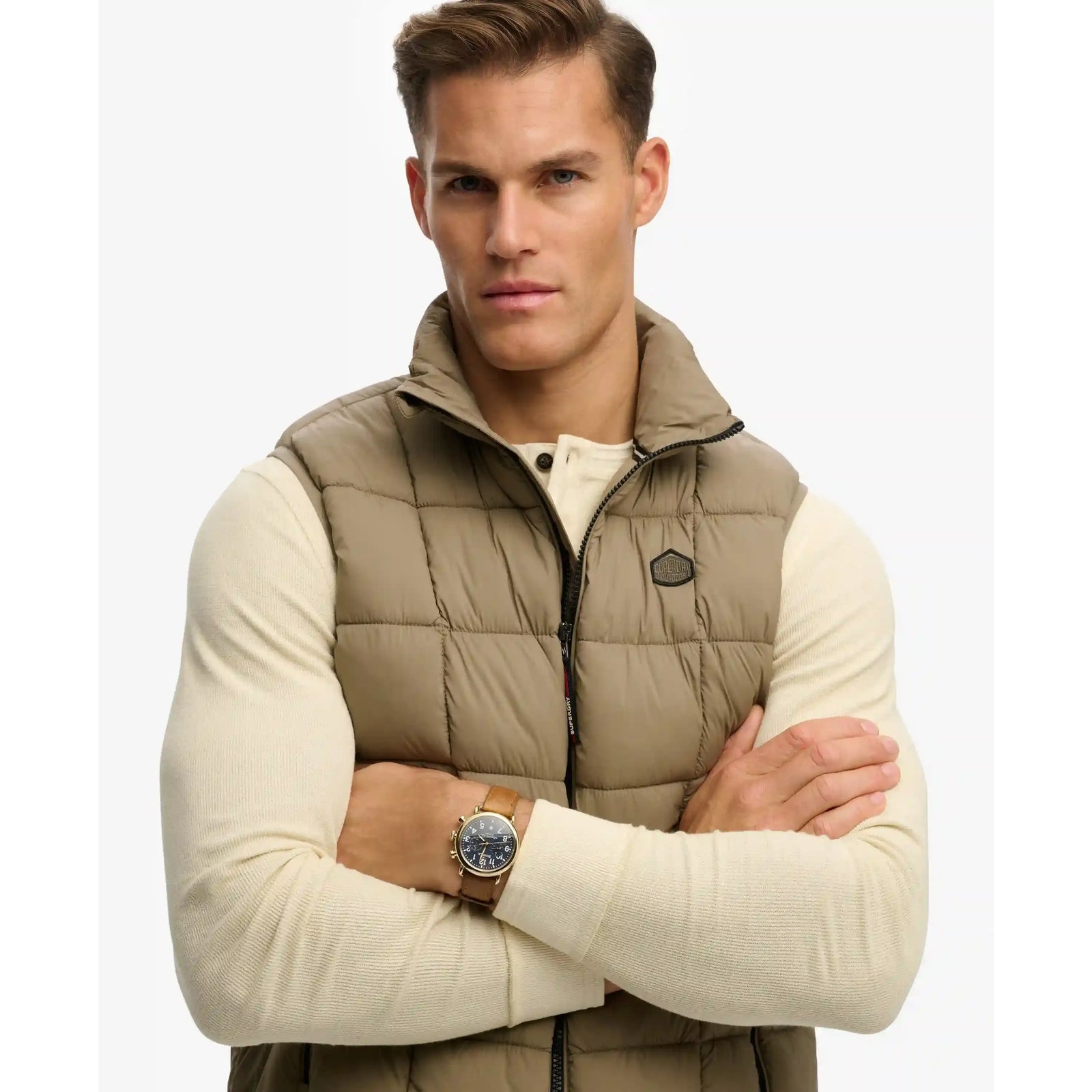 Men's Superdry Box Quilt Fuji Lite Gilet in beige, a quilted sleeveless jacket with zip front and subtle logo patch.