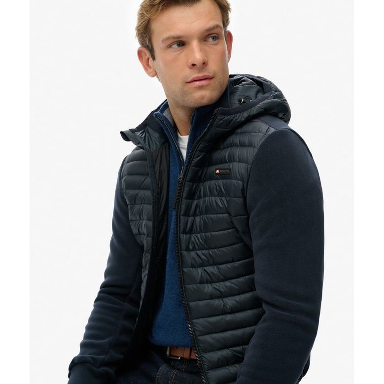 Model wearing Superdry Hooded Storm Fleece: quilted padded body with plush fleece sleeves.