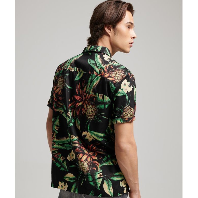 Superdry Vintage Hawaiian S/S Shirt on male model, black tropical print with palms and pineapples.