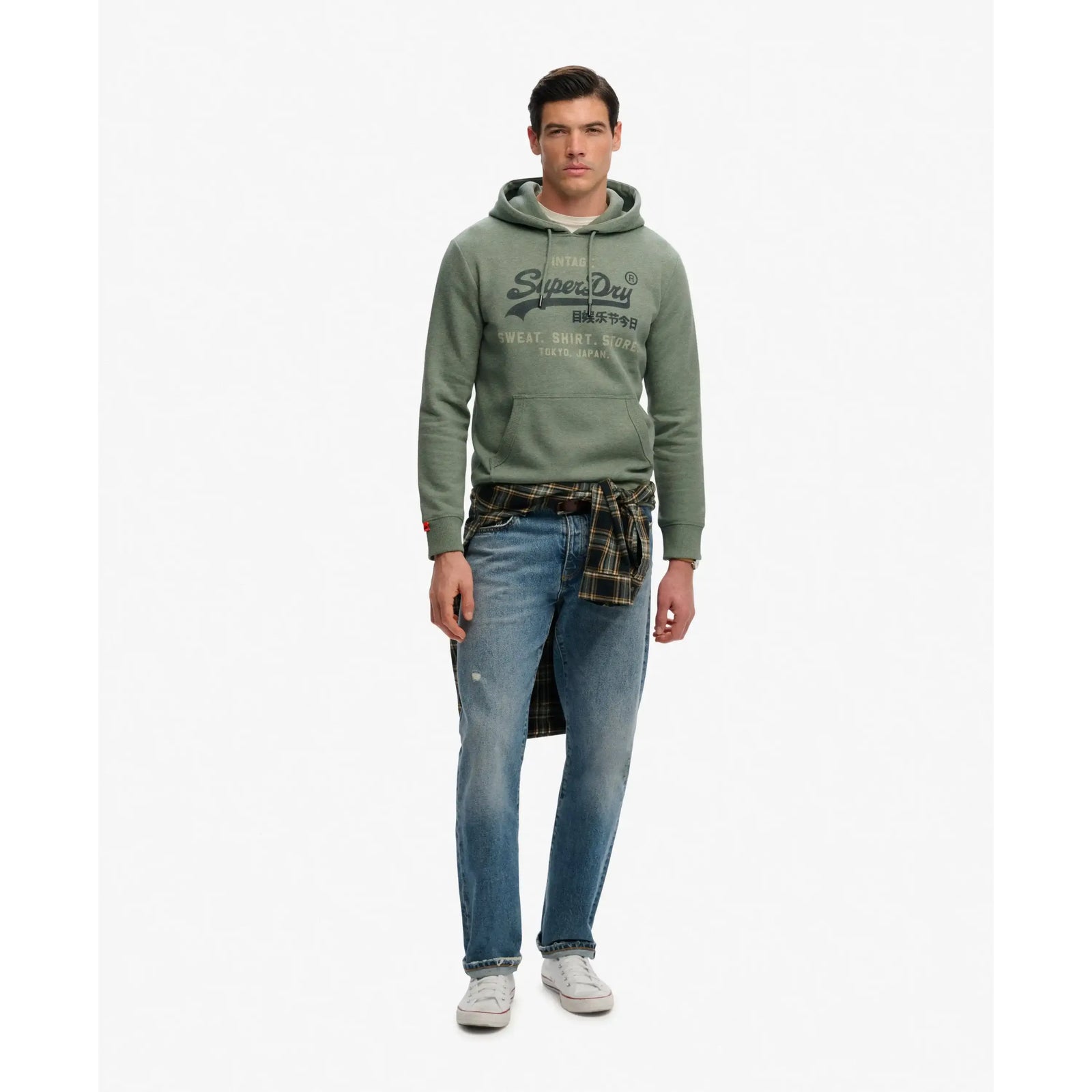 Man in green Superdry VL Heritage Relaxed Hoodie with faded chest logo and lightly brushed lining.