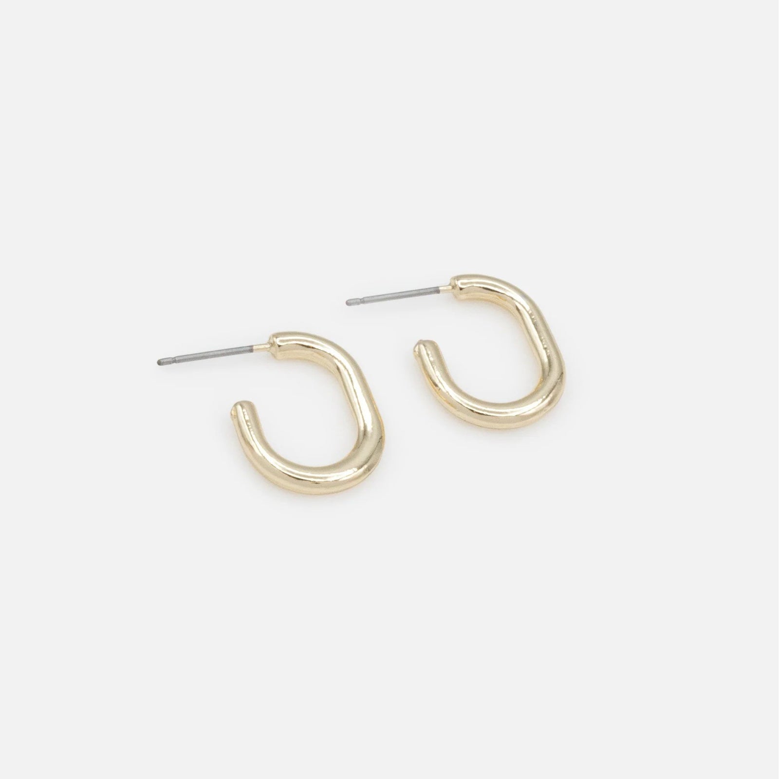 Tiny gold hoop earrings with a smooth curved design and hypoallergenic metal.