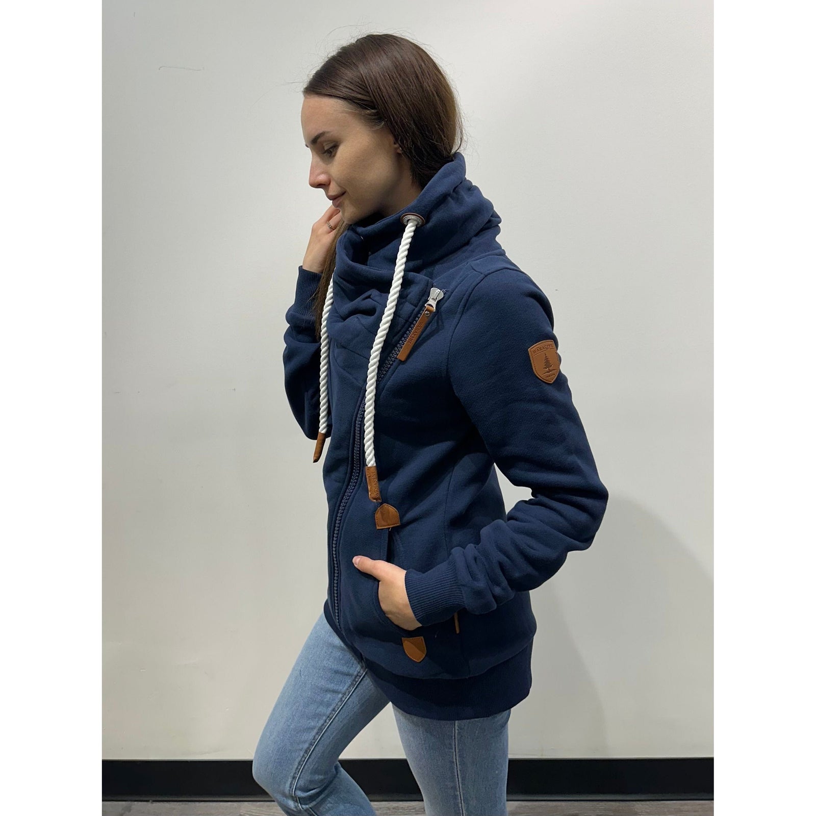 Stay cozy in the Wanakome Hestia Zip Up, featuring premium fleece and a stylish funnel neck design.