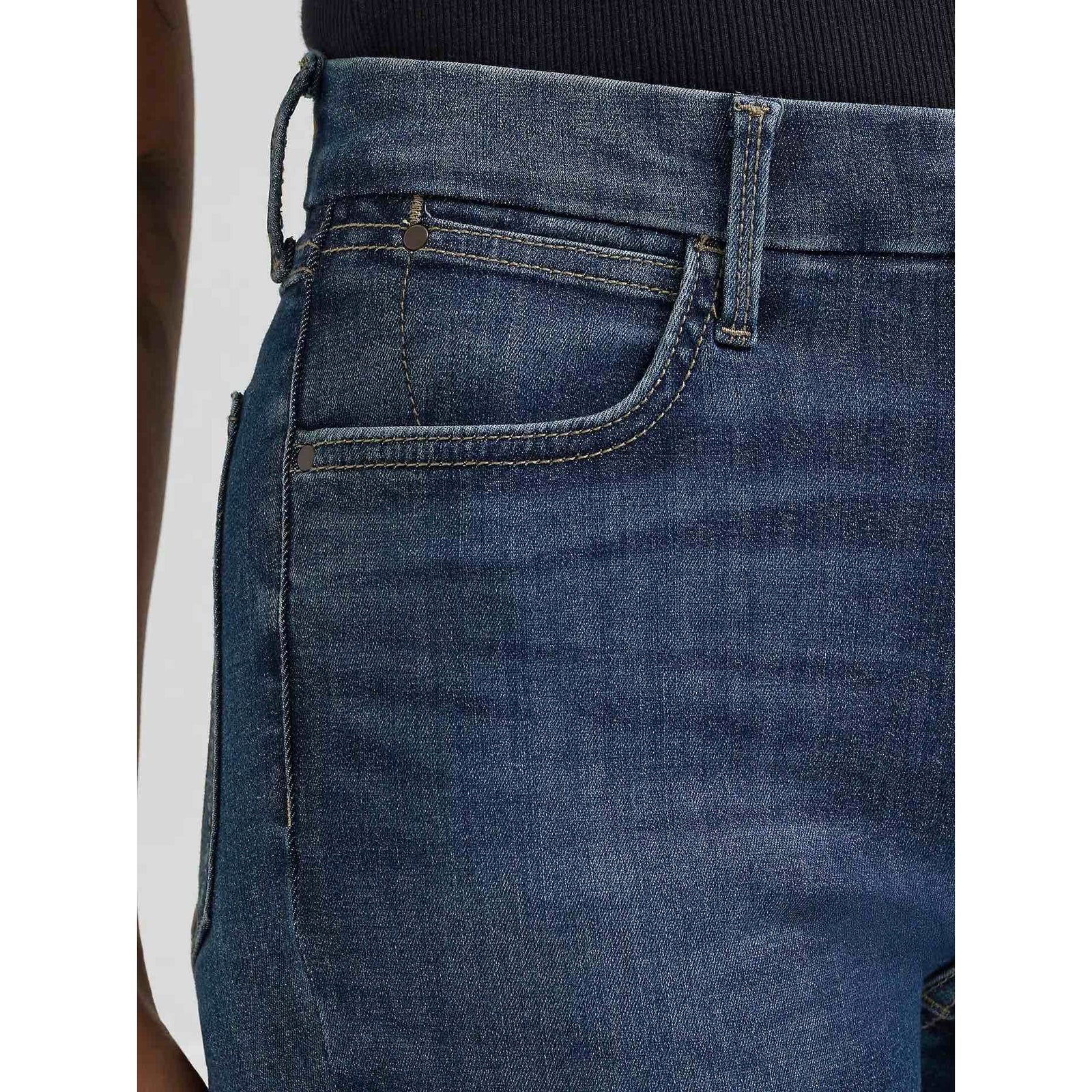 Wrangler Bespoke High-Rise Bootcut jeans in Lacey; close-up of contoured waistband and front pocket.