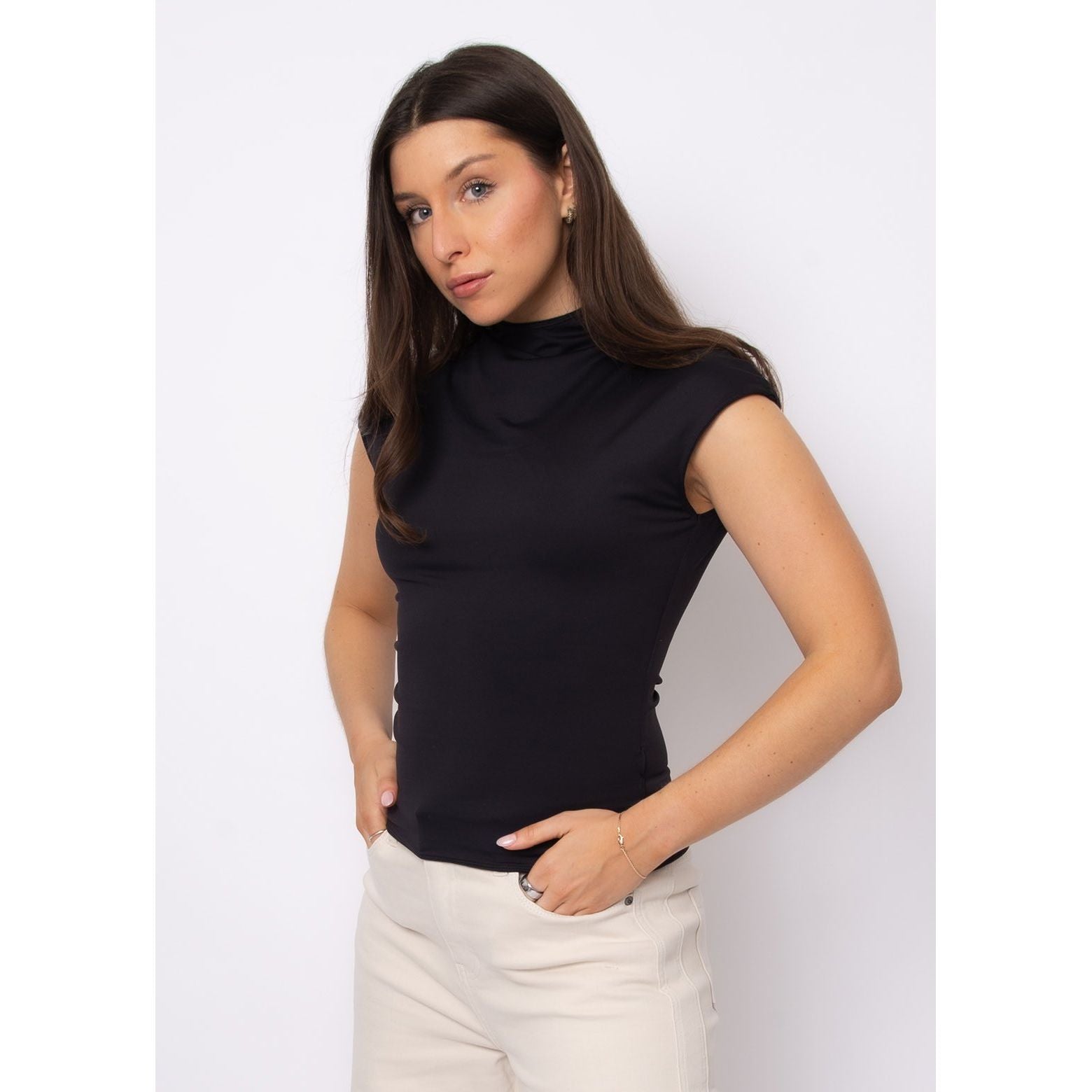 Model wears Yvette Funnel Neck Draped Top in black, sleeveless with refined funnel neckline and butter-soft drape.