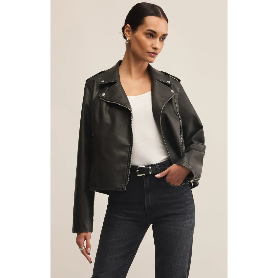 Z Supply Alchemy Faux Leather Moto Jacket on a model; sleek black faux leather with silver zippers and belt.