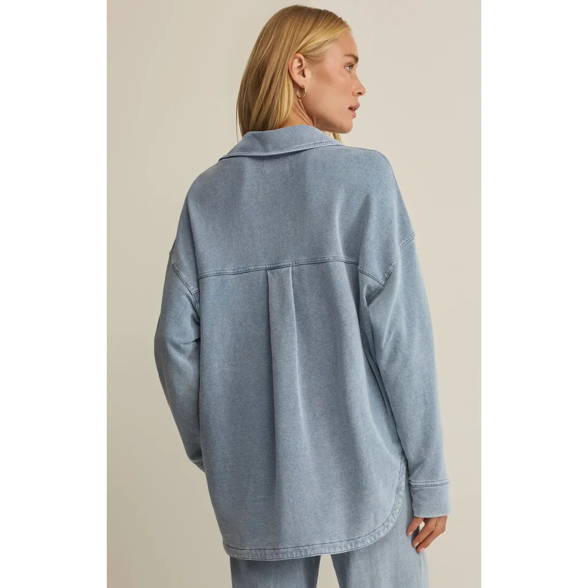 Back view of Z Supply All Day Knit Denim Jacket in light wash, oversized silhouette.