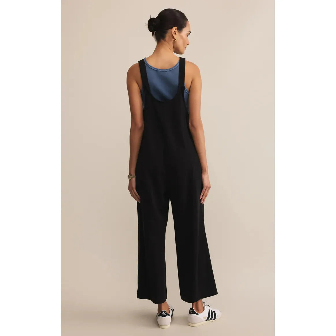 Z Supply Brasilia Everyday Jersey Jumpsuit in true black, back view with wide straps and patch pockets.