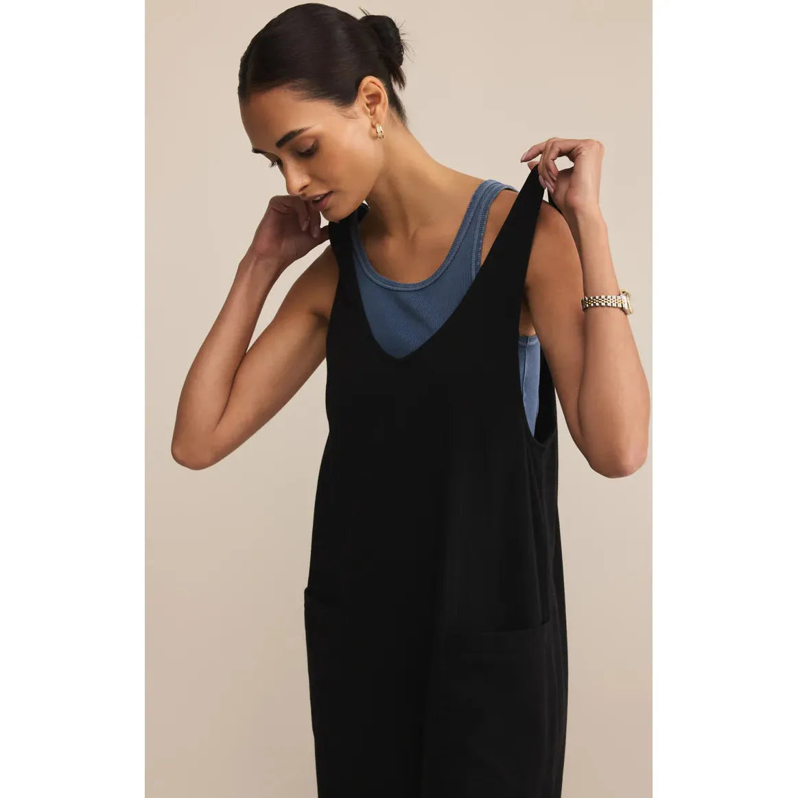 Z Supply Brasilia Everyday Jersey Jumpsuit in black worn over a blue top for casual all-day wear.