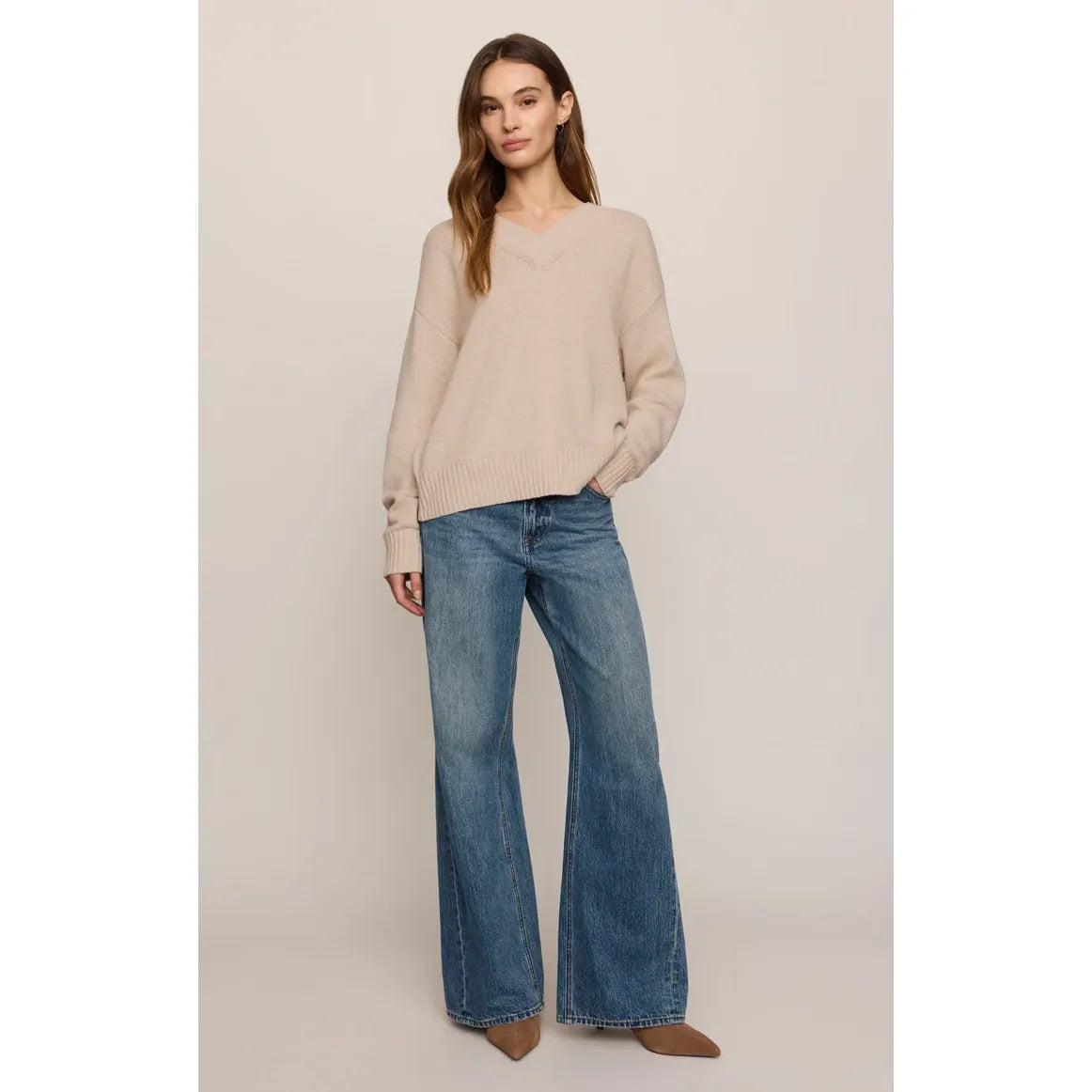 Z Supply Cloud Spun V-Neck Sweater in Frosted Pearl paired with flared jeans for a soft, relaxed layer.