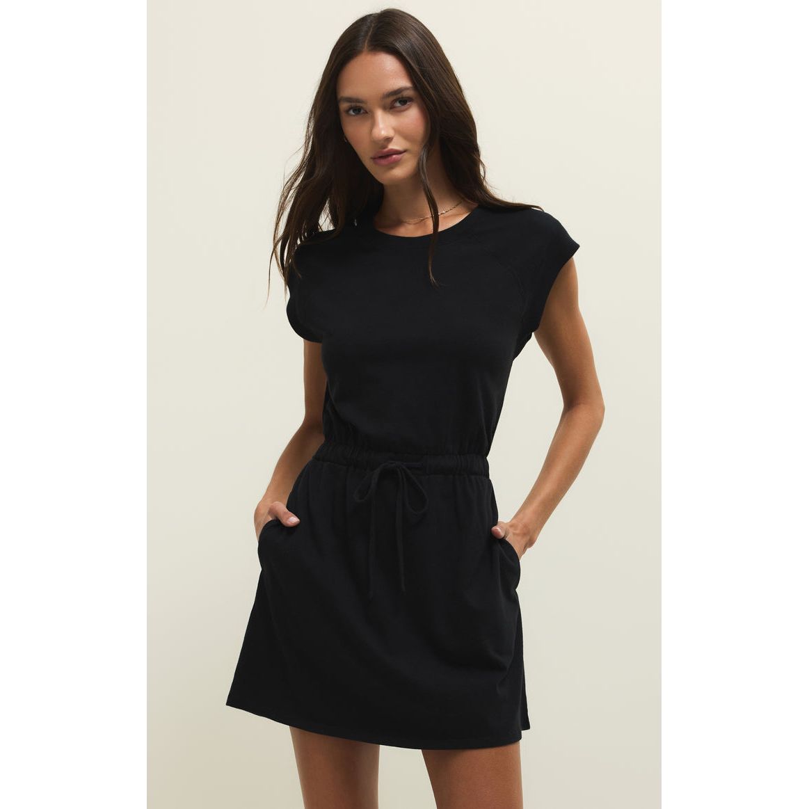 Z Supply Kalani Mini Dress in black with elastic waist and pockets.