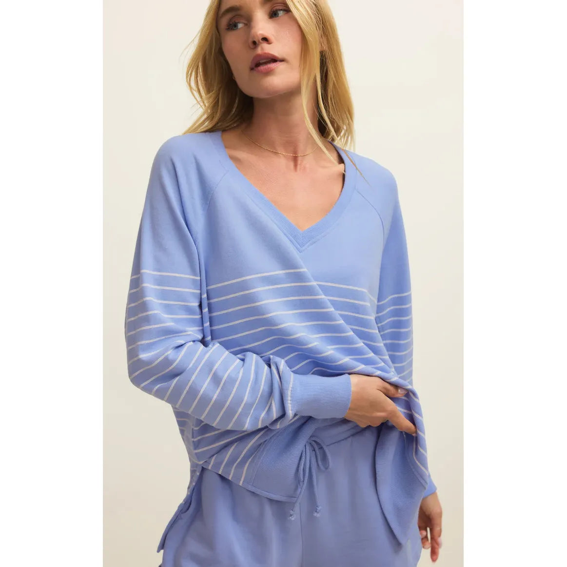 Z Supply Weekender V-Neck Stripe relaxed blue striped sweatshirt with V-neck worn by model.