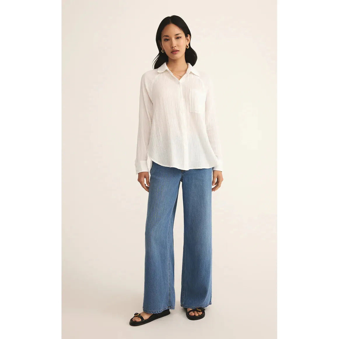 Stylish model wearing the Z Supply Perfect Airy Gauze Top, showcasing its relaxed fit and breezy comfort.