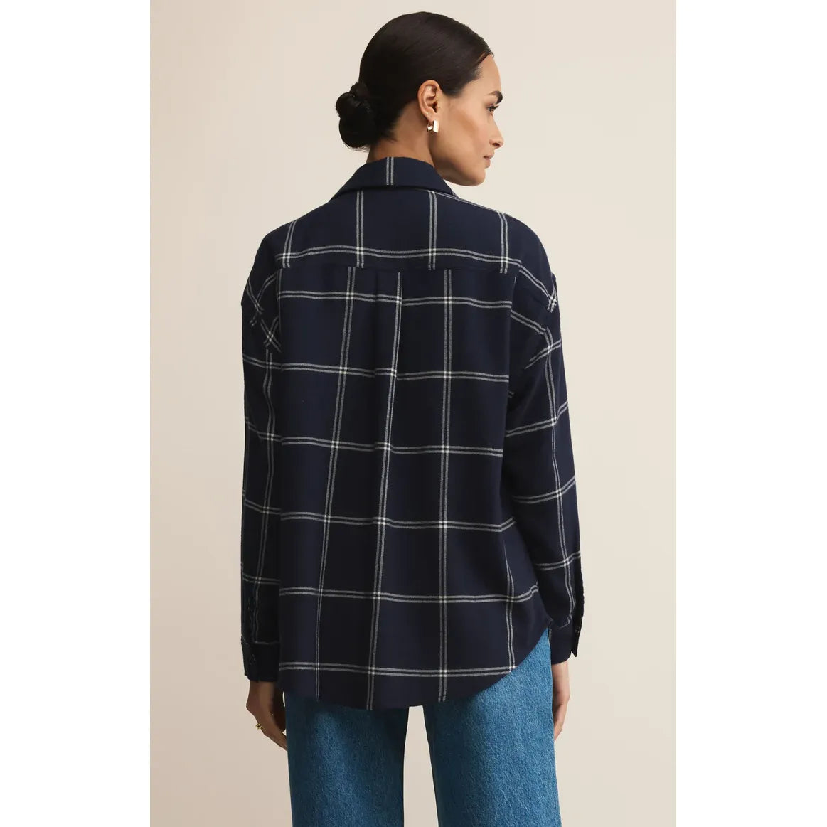 Sharlene in size small wears Z Supply River Plaid Button Up Top, navy with white plaid, back view.