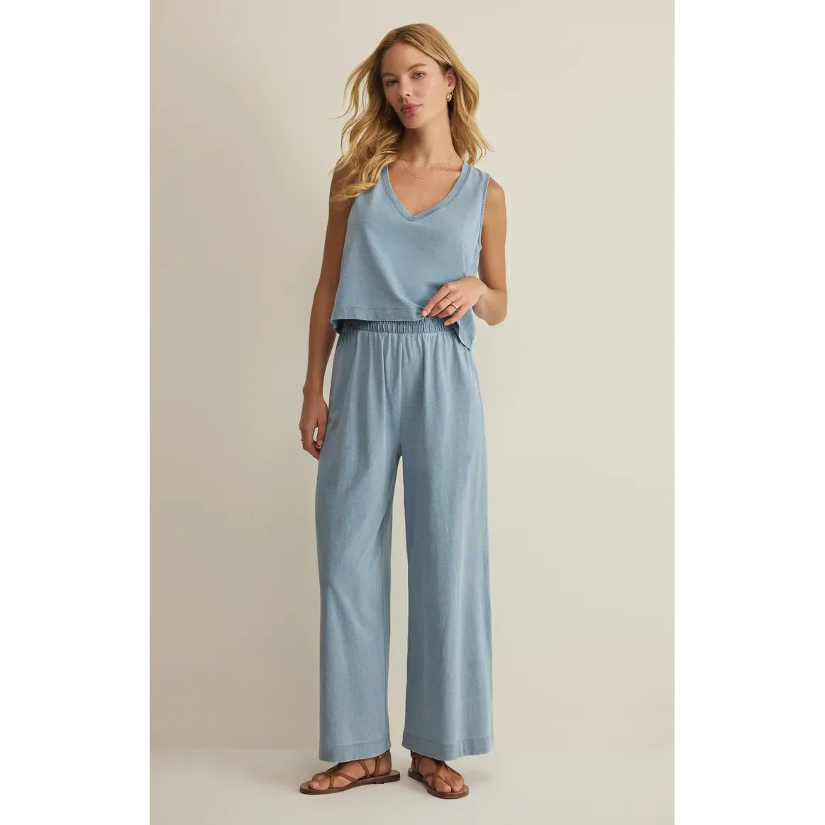 Z Supply Scout Jersey Crop Flare Pant set in light blue with high-rise elastic waist and cropped flare, matching tank.
