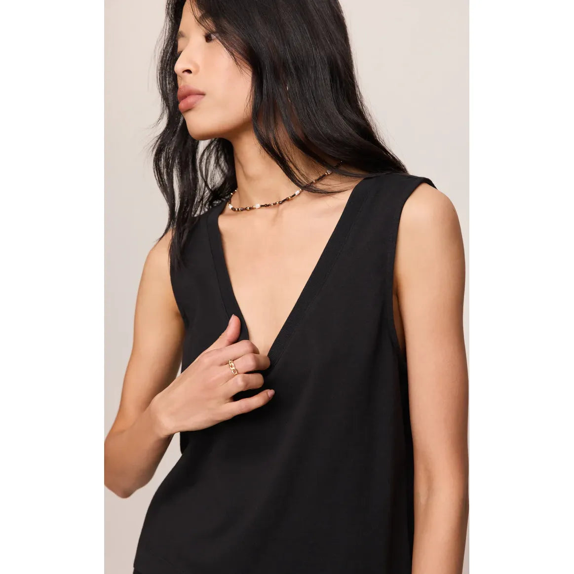 Model wears Z Supply Sloane V-Neck Tank, black cotton jersey sleeveless top with relaxed fit.