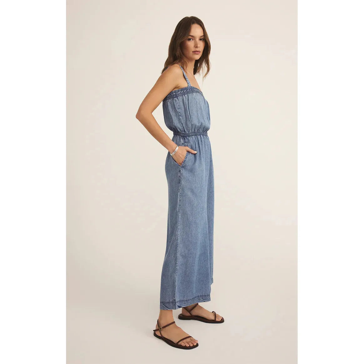 Effortlessly stylish, the Z Supply Solara Chambray Jumpsuit features a square neckline and adjustable straps.
