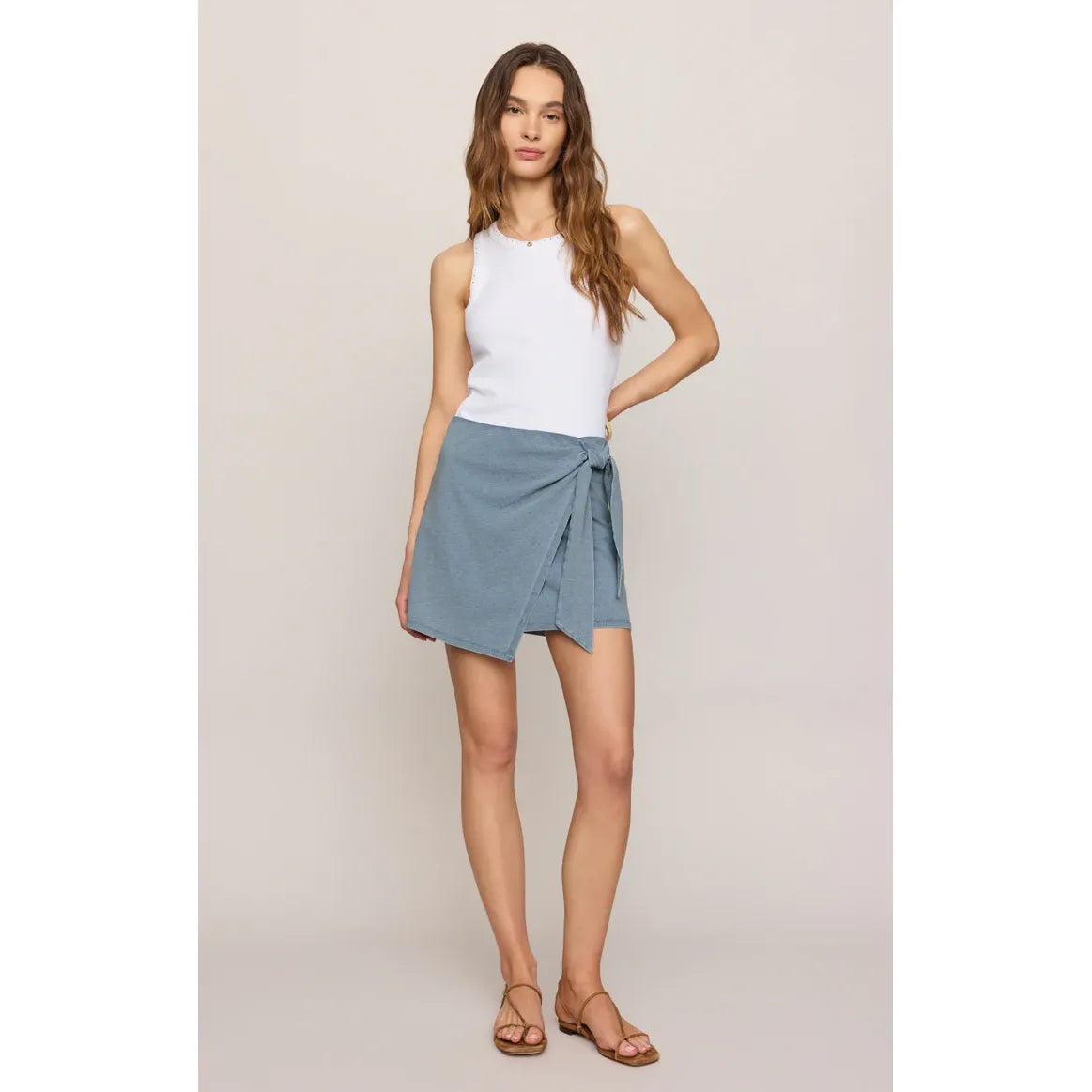 Z Supply Sora Denim Mini Skirt: pull-on, sun-faded denim look with asymmetrical wrap and adjustable side tie.