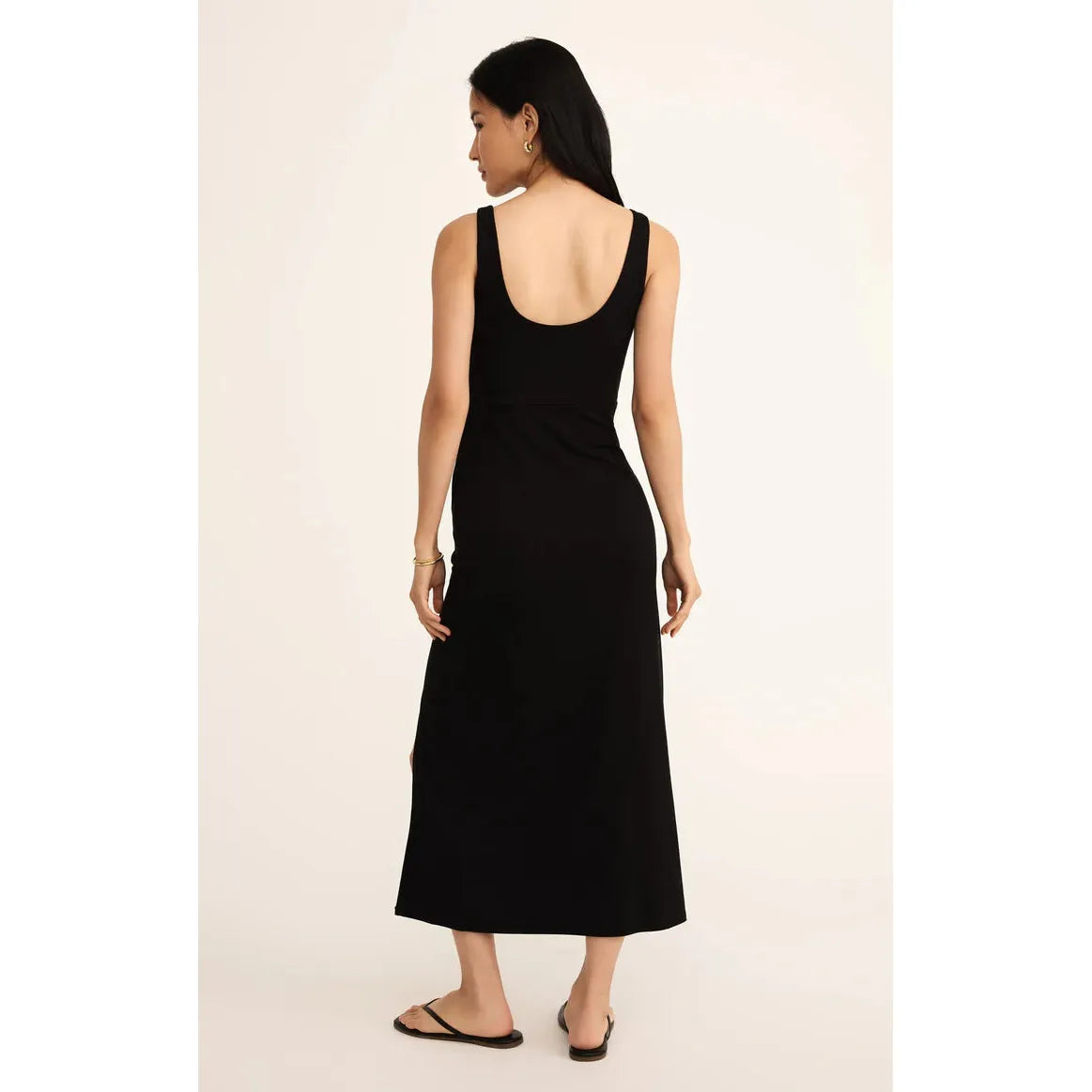 Stylish Z Supply Valencia Midi Dress in black, featuring a fitted silhouette and playful mid-thigh slit for a flattering look.