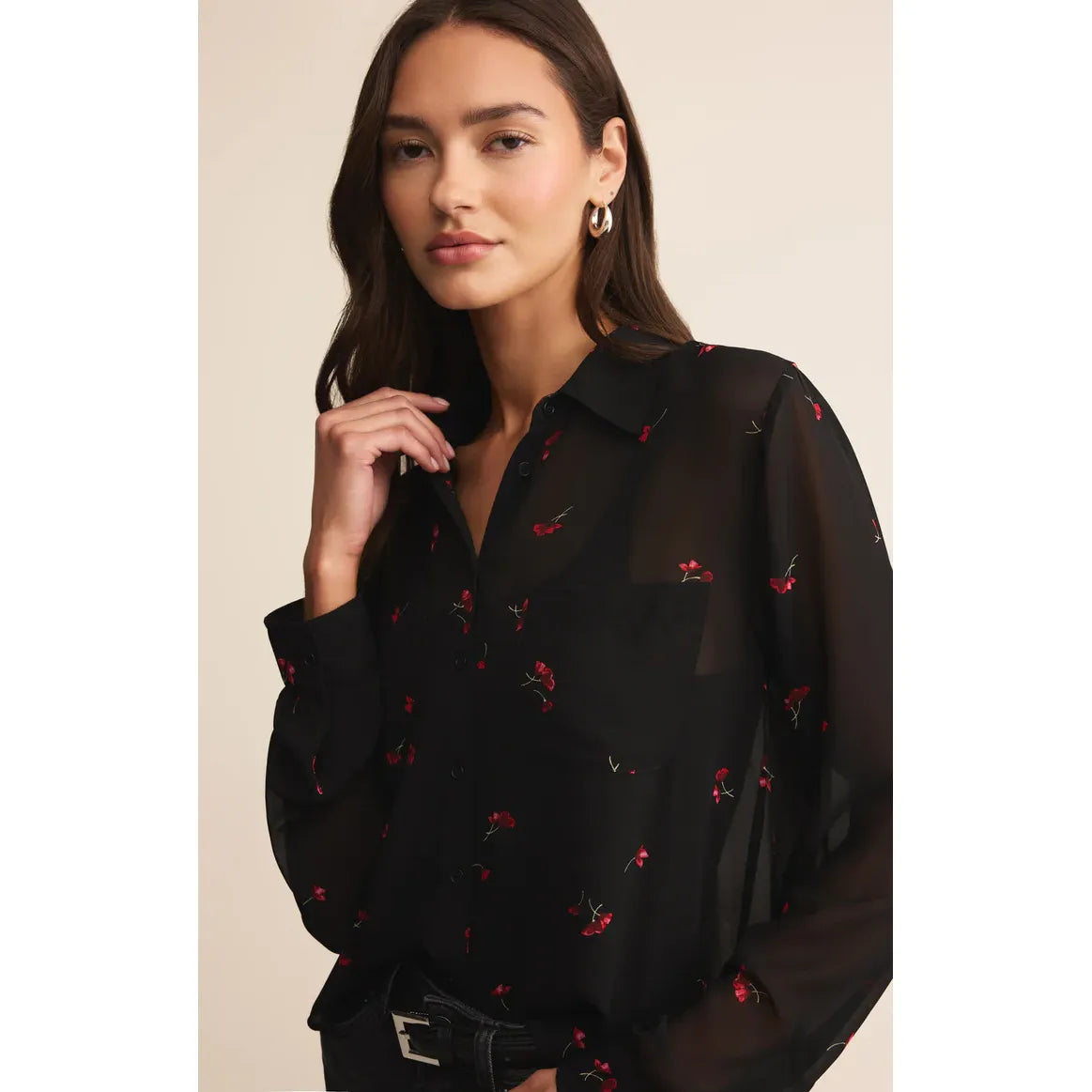 Model wearing Z Supply Vivienne Rio Floral Top, a black sheer long-sleeve button-up with red floral print.