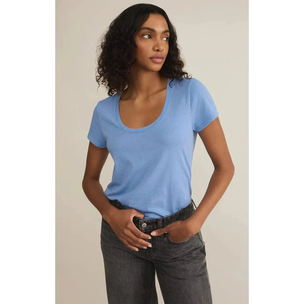 Stylish model showcasing the Z Supply Anywhere Scoop Tee in blue, perfect for any casual outing or adventure.