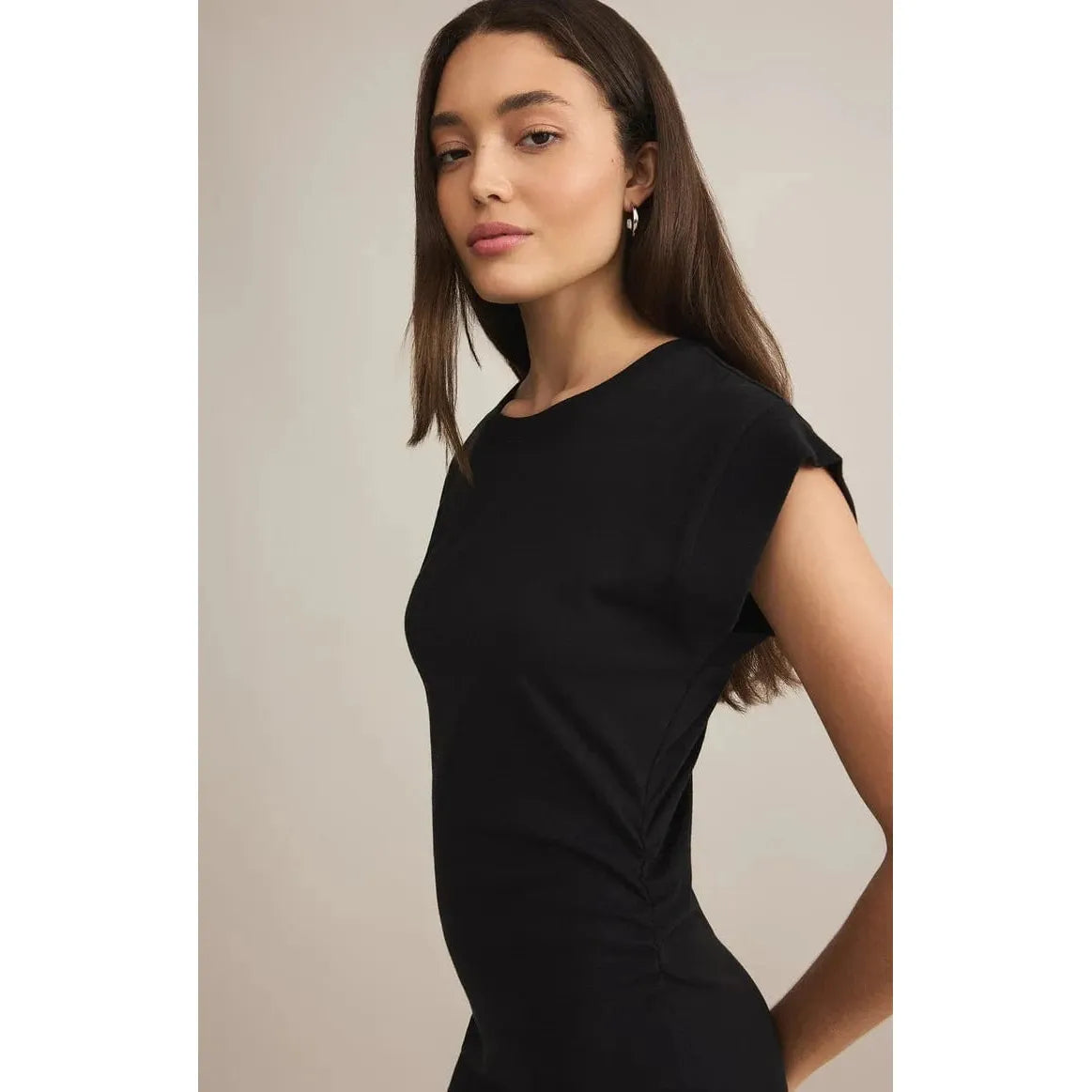 Stylish model showcases the Z Supply Camino Mini Dress with cap sleeves and a flattering fit, perfect for any occasion.