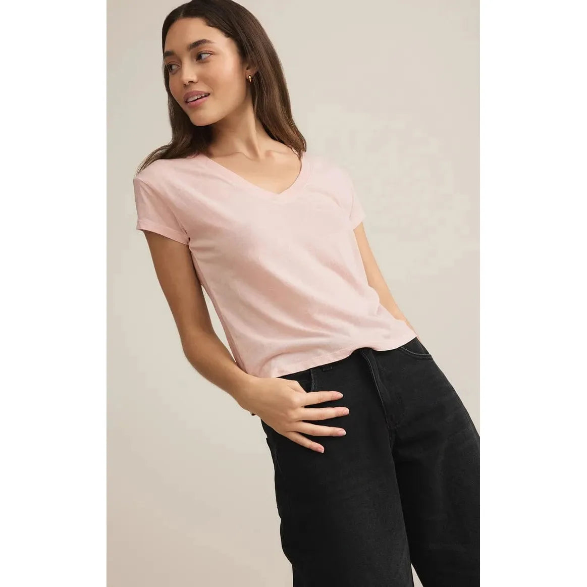 Stylish model wearing the Z Supply Modern Jersey V-Neck Tee in pink, perfect for casual, comfortable outings.
