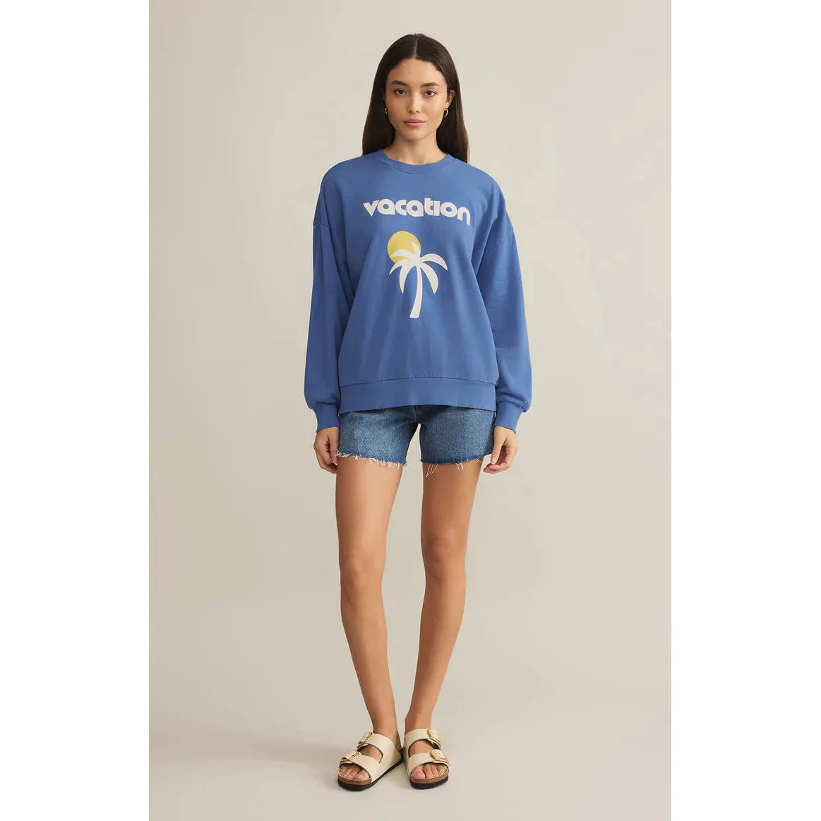 Stay stylish in the Z Supply Vacay Sunday Sweat Shirt, featuring a comfy oversized fit and "Vacation" graphic.