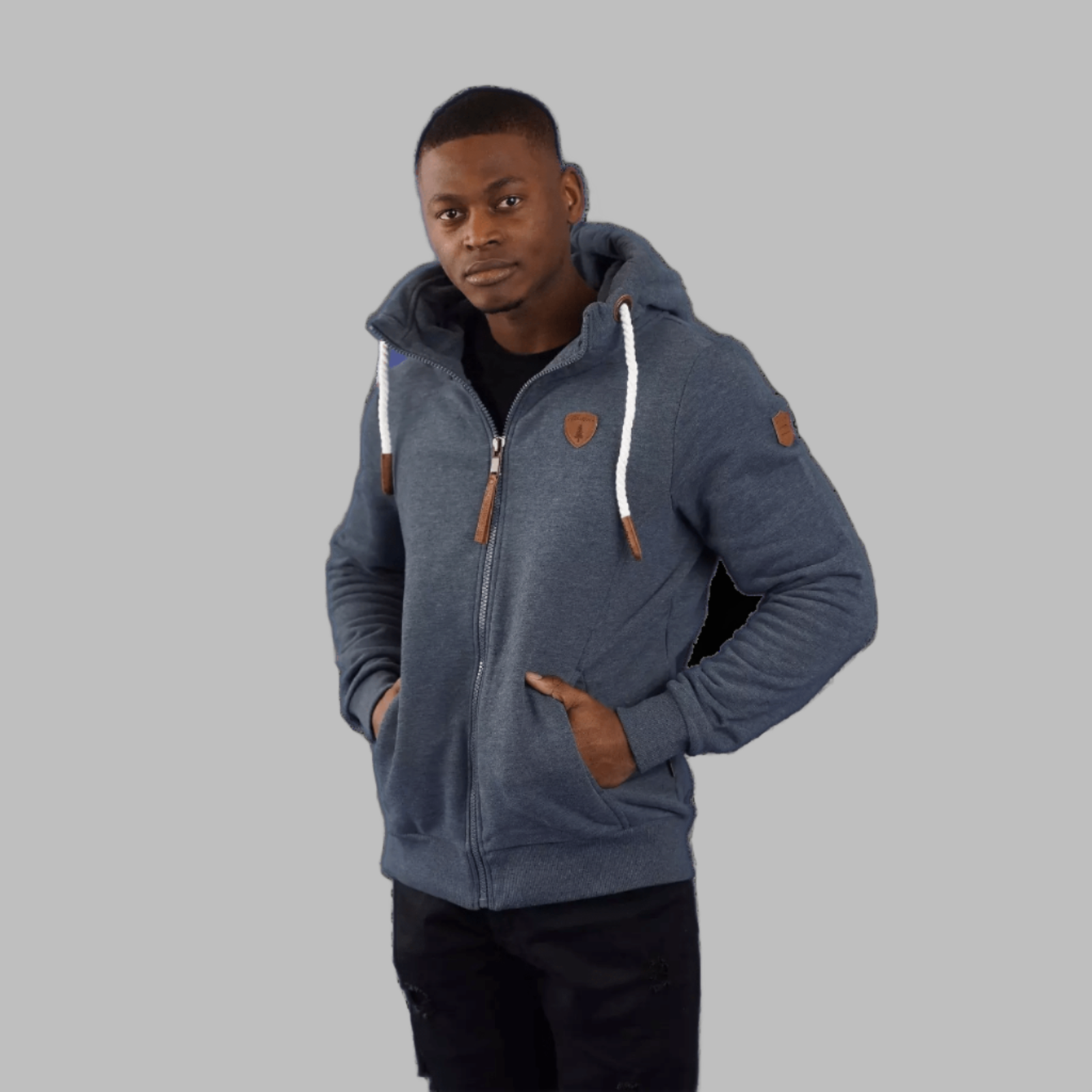 Wanakome Zeus Hoodie on model, navy zip hoodie with white drawstrings and leather accents.