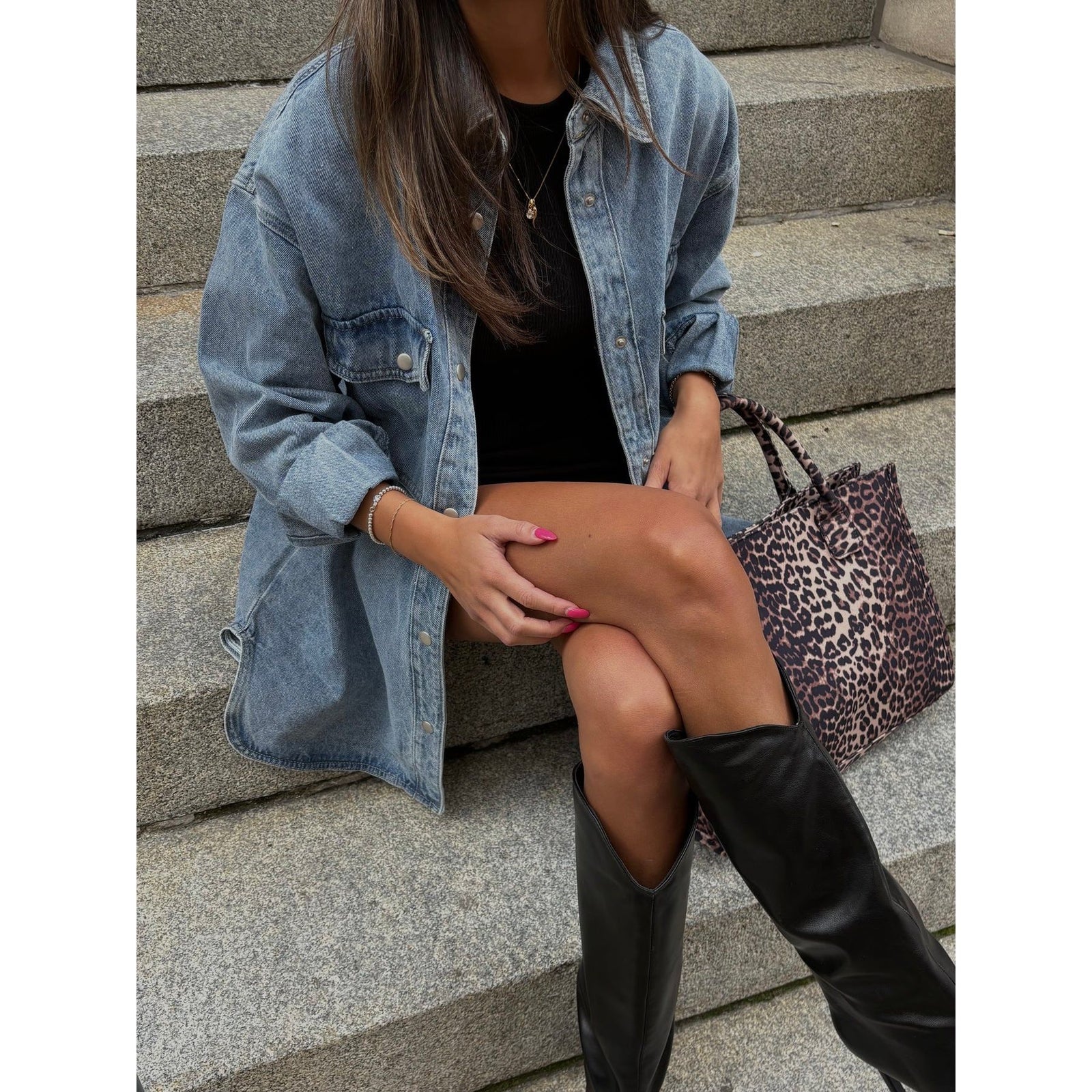 Brunette the Label Shania Denim Jacket oversized with dropped shoulders, model in black top, leopard tote on steps.