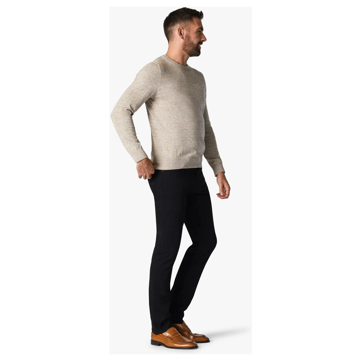 Stylish man wearing 34 Heritage Courage Black Vintage Comfort pants, combining denim look with ultimate comfort.