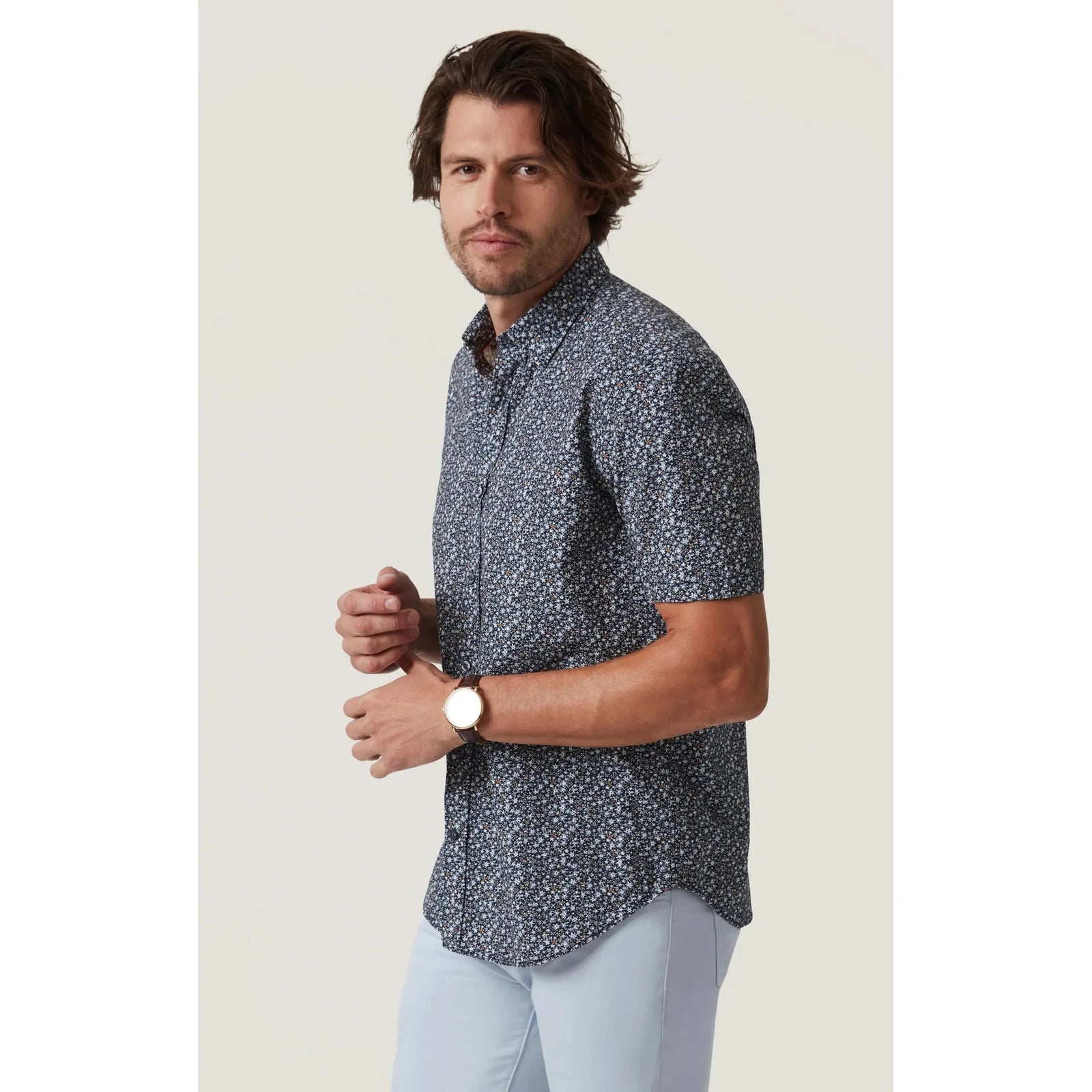 Stylish man wearing the 34 Heritage Field Short Sleeve Shirt, featuring a playful pattern perfect for warm days.