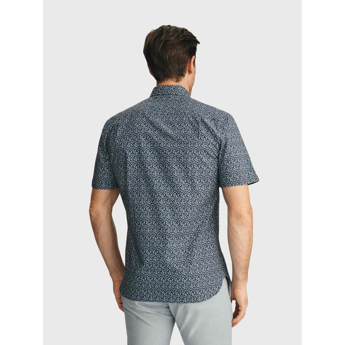 Back view of a man in 34 Heritage Flower Luxe Twill Shirt with vintage indigo mini floral print, short-sleeve button-up