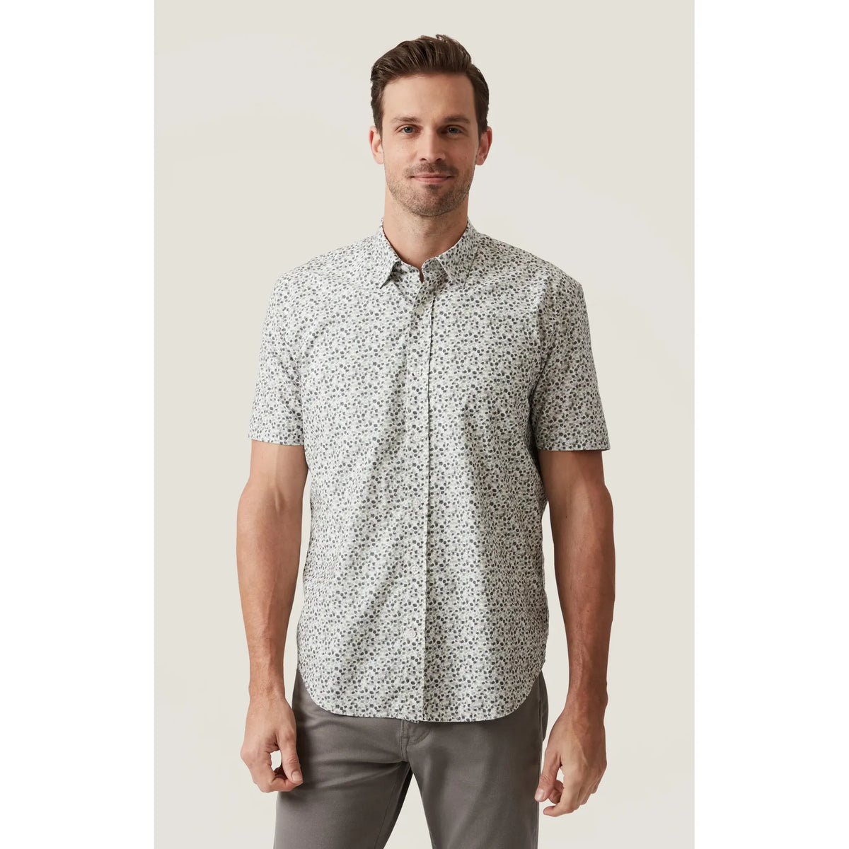 34 Heritage Grove Short Sleeve Shirt in a small floral print, breathable cotton-Tencel blend, worn by a man.