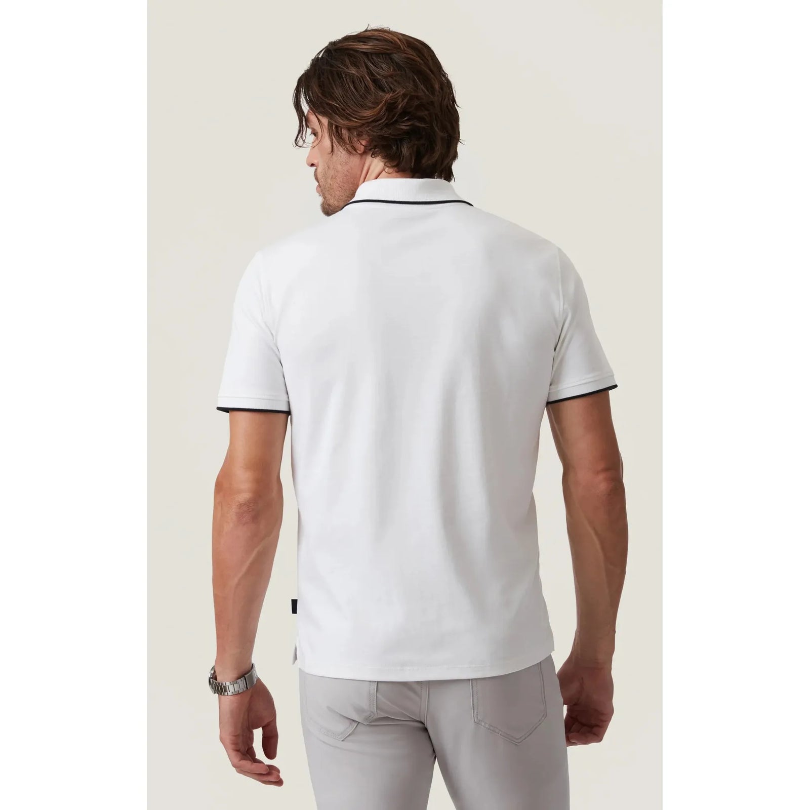 Stylishly showcasing the 34 Heritage Riviera Polo with elegant detailing, perfect for golf or dressed-up occasions.