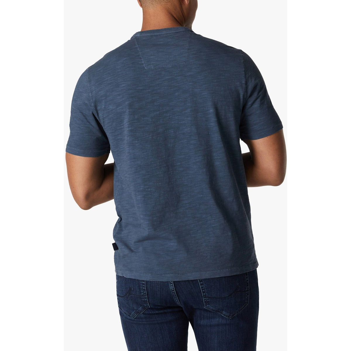 Back view of a man wearing 34 Heritage Slub Crew Tshirt in blue, lightweight cotton-jersey with short sleeves.