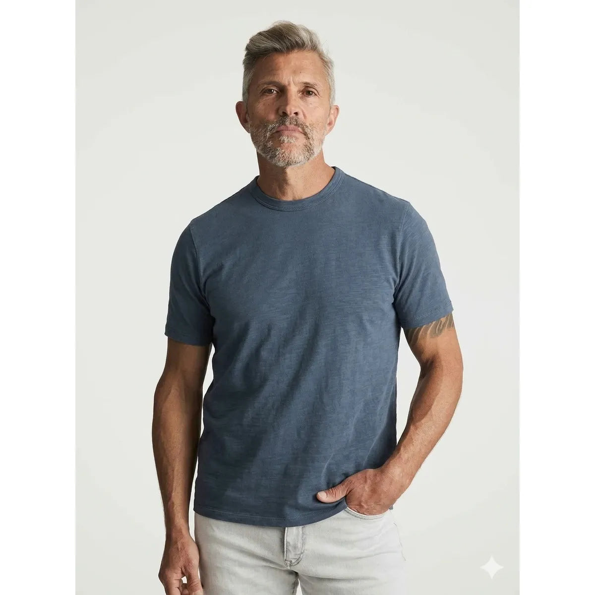Male model in blue 34 Heritage Slub Crew Tshirt, short-sleeve crewneck made from lightweight 100% BCI cotton-jersey.