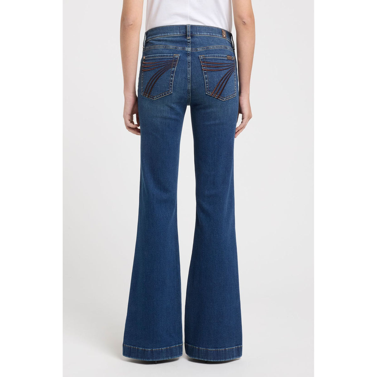 7 for all Mankind Dojo in Koko mid-rise flare jeans back view with arched brown embroidery on back pockets.