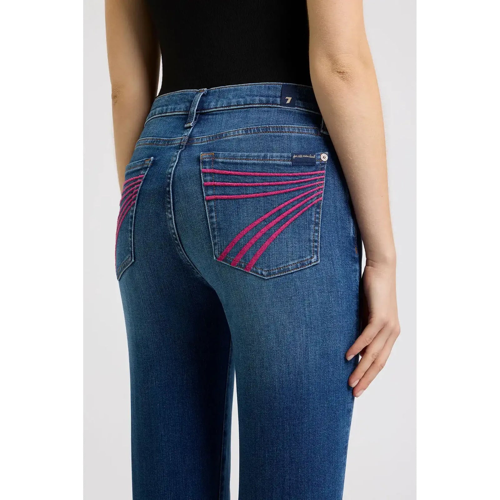 7 for all Mankind Dojo jeans in Moonwater, back view with pink stitched pocket lines and mid-rise flare.