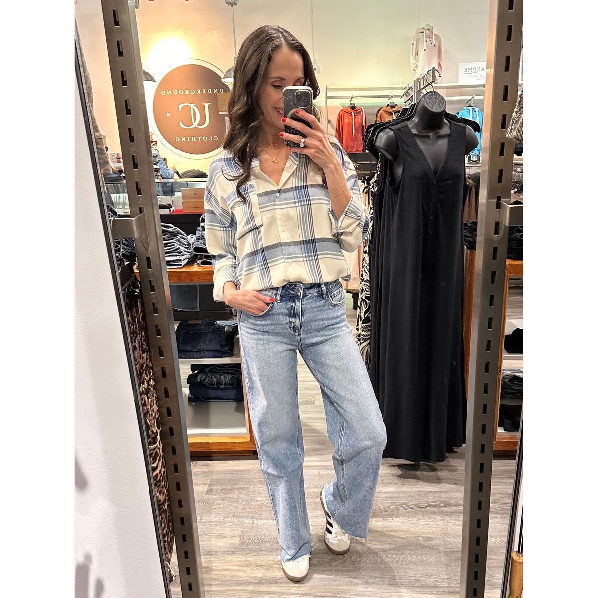 Model wearing Z Supply River Plaid Button Up Top with light-wash jeans in a casual store look.